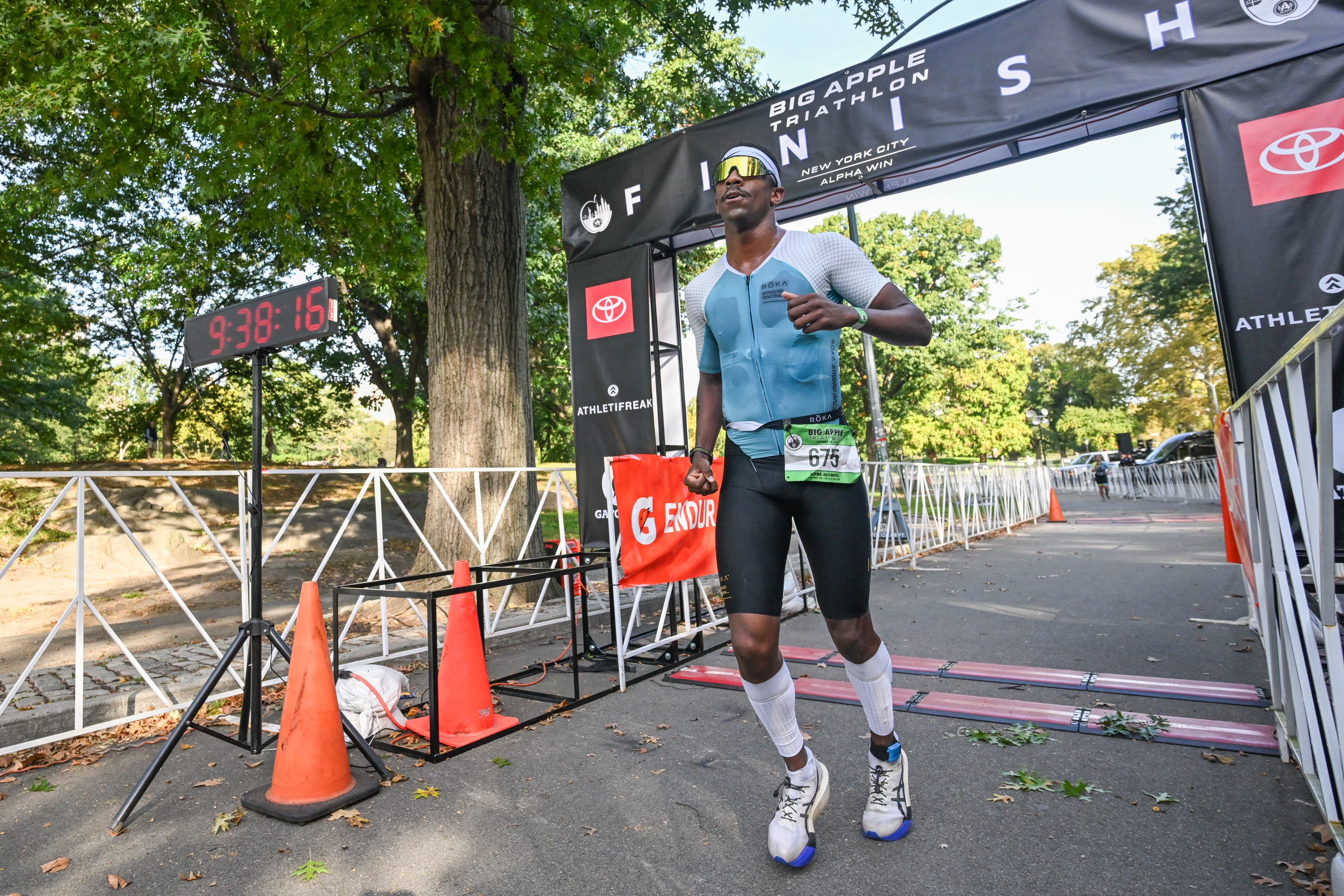 Andrew Gray crosses the finish line to win the Big Apple Triathlon, with a time of 1hr 58mins.