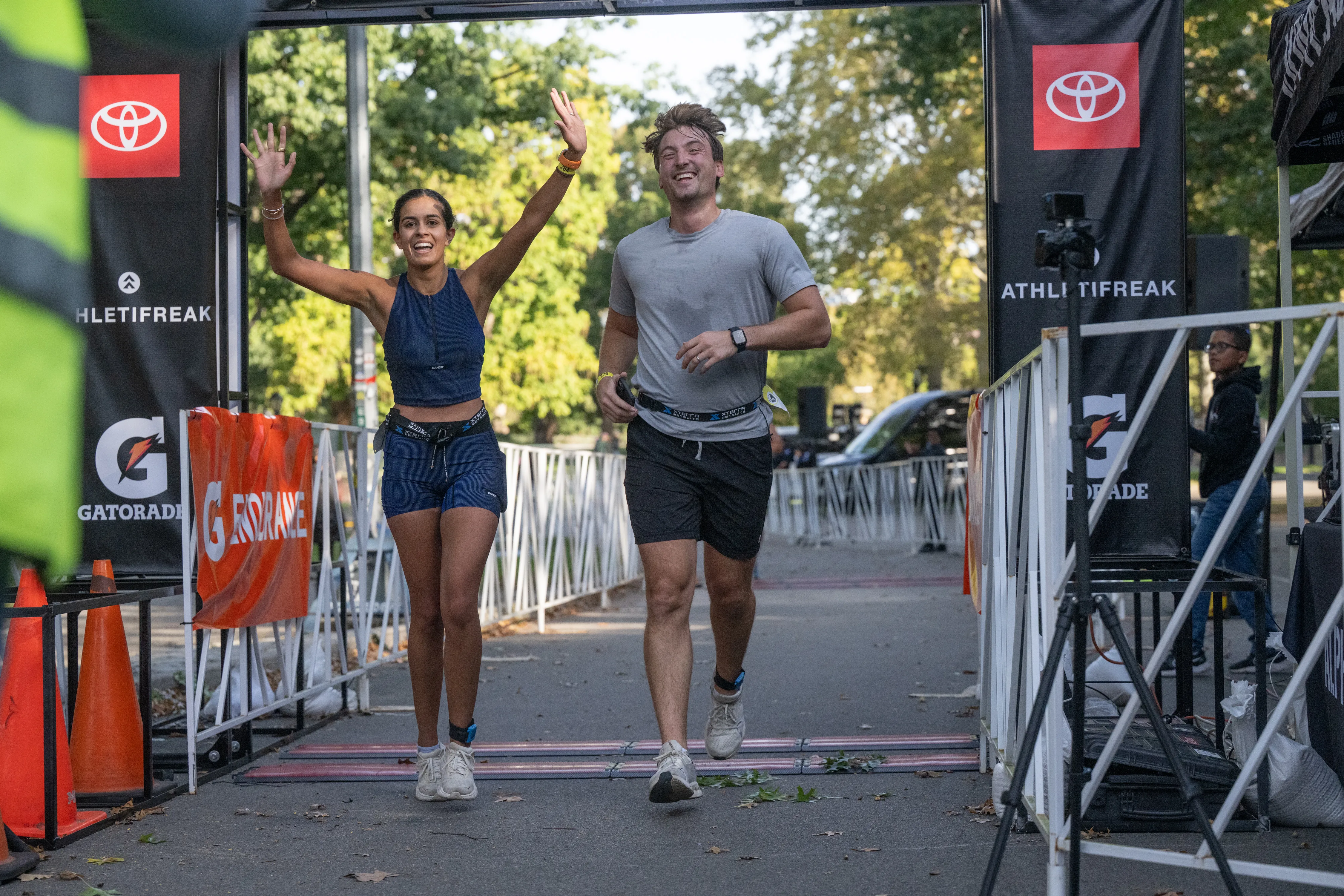 Runners approach the finish line during the Big Apple Triathlon in Central Park.
