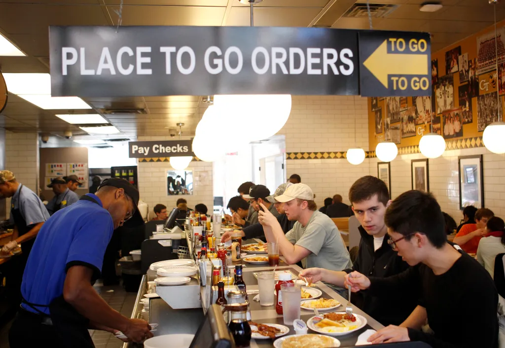 Customers fill the counter at a Waffle House restaurant.