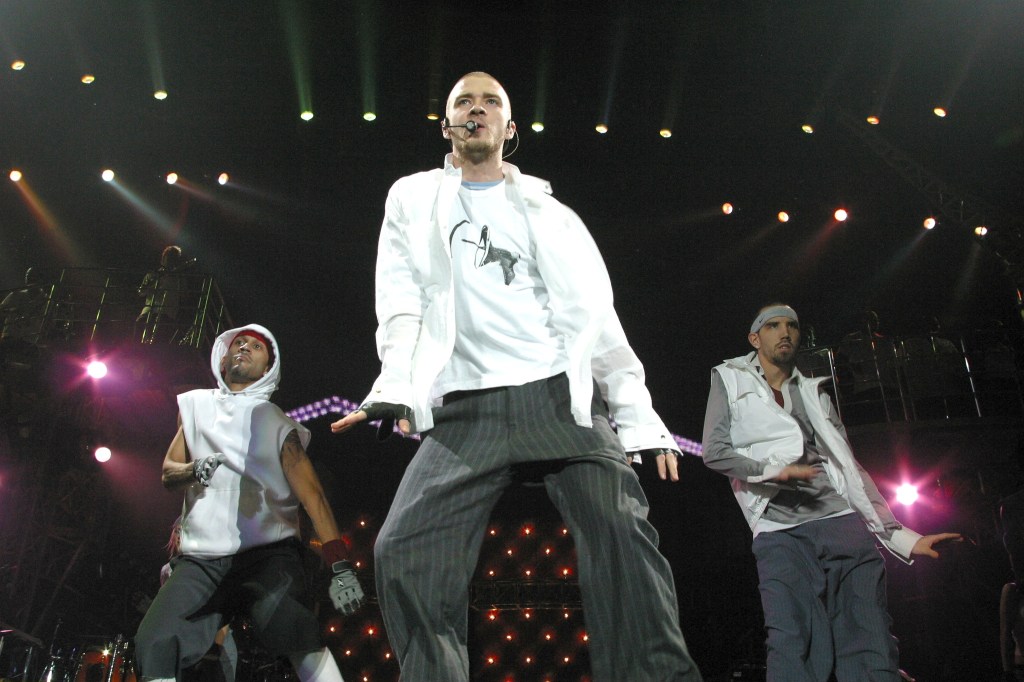 Justin Timberlake performing on stage with dancers in Berlin.