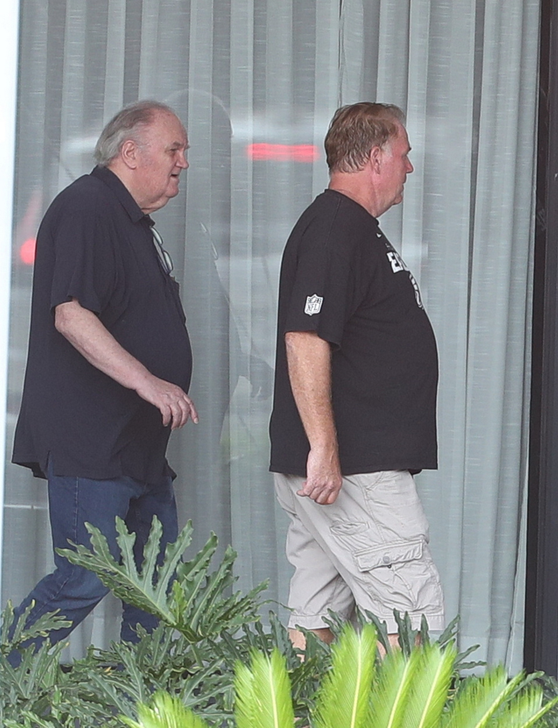 Thomas Markle and his son, Tom Markle Junior, walking together.