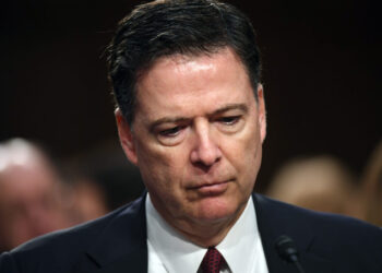 Judge weighs whether Justice Dept. violated statute in charging James Comey