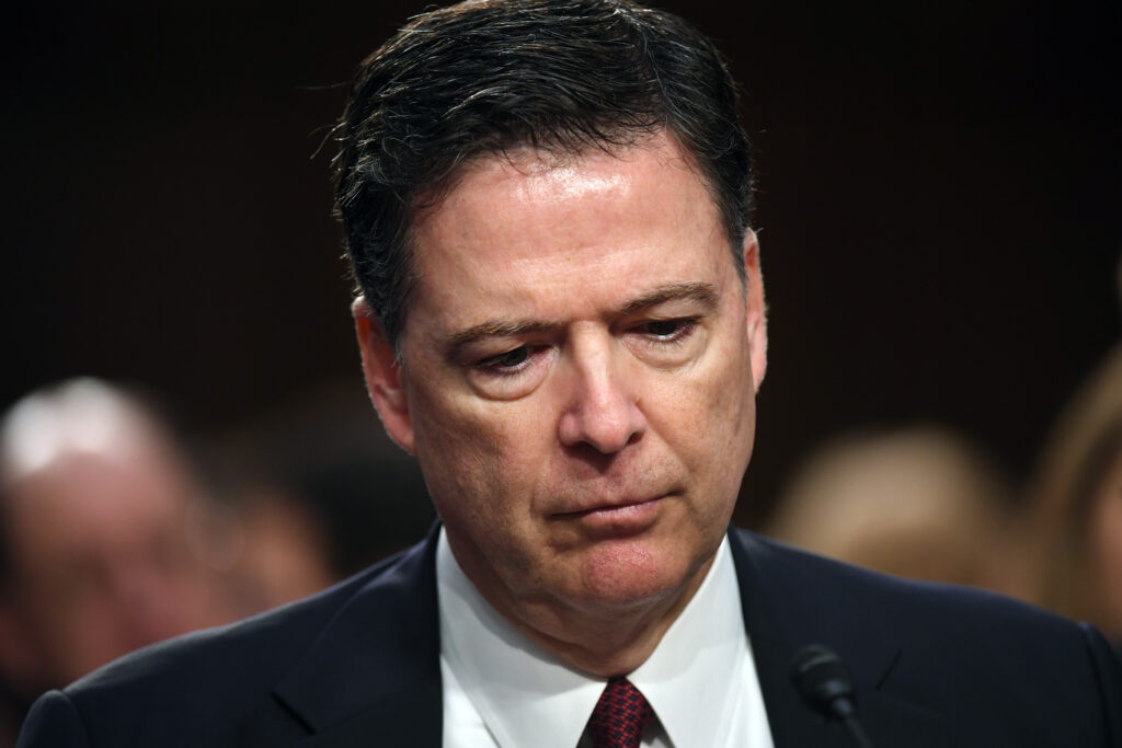 Judge weighs whether Justice Dept. violated statute in charging James Comey