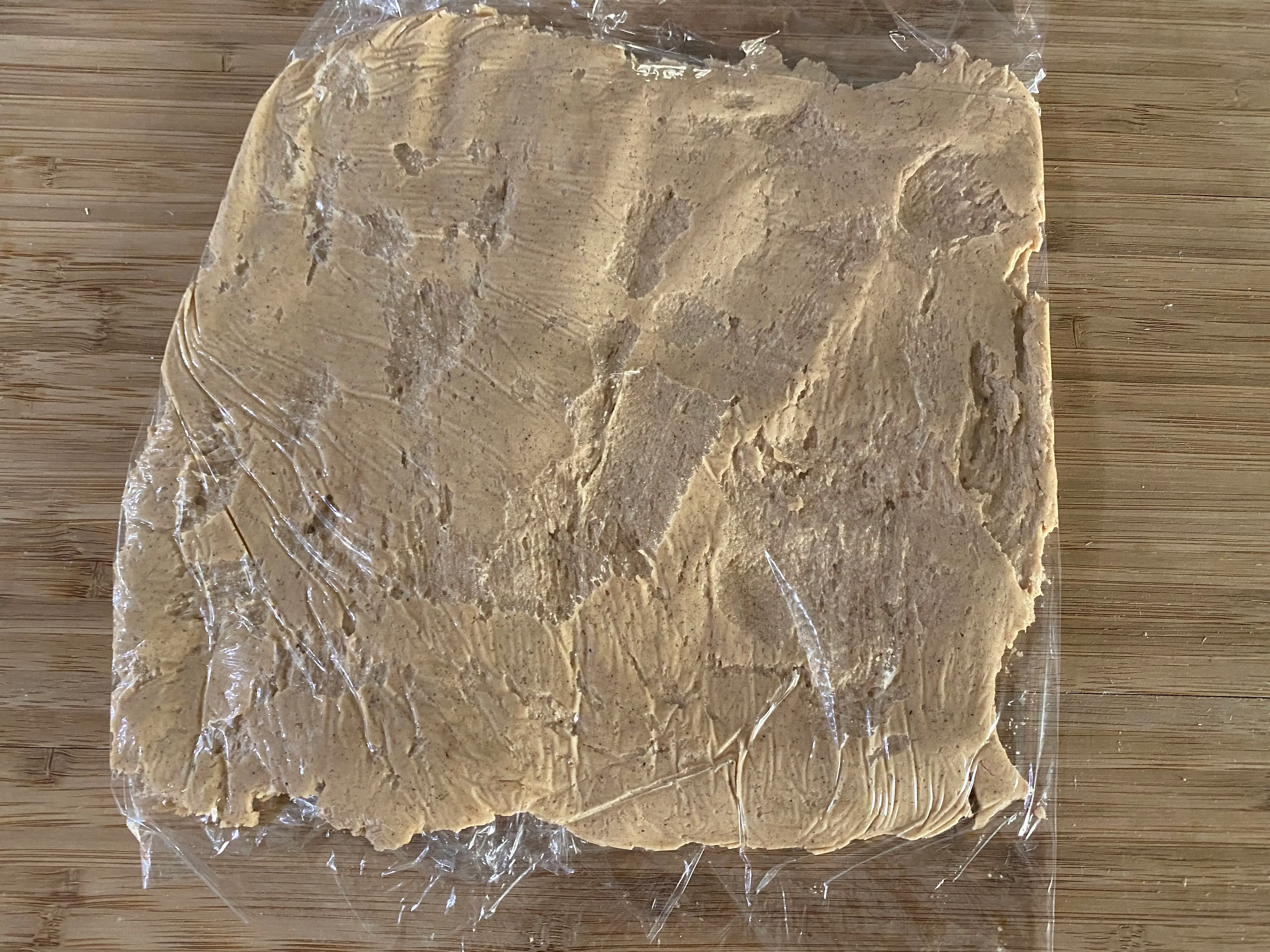 Dominique Ansel pie crust in plastic wrap in square shape
