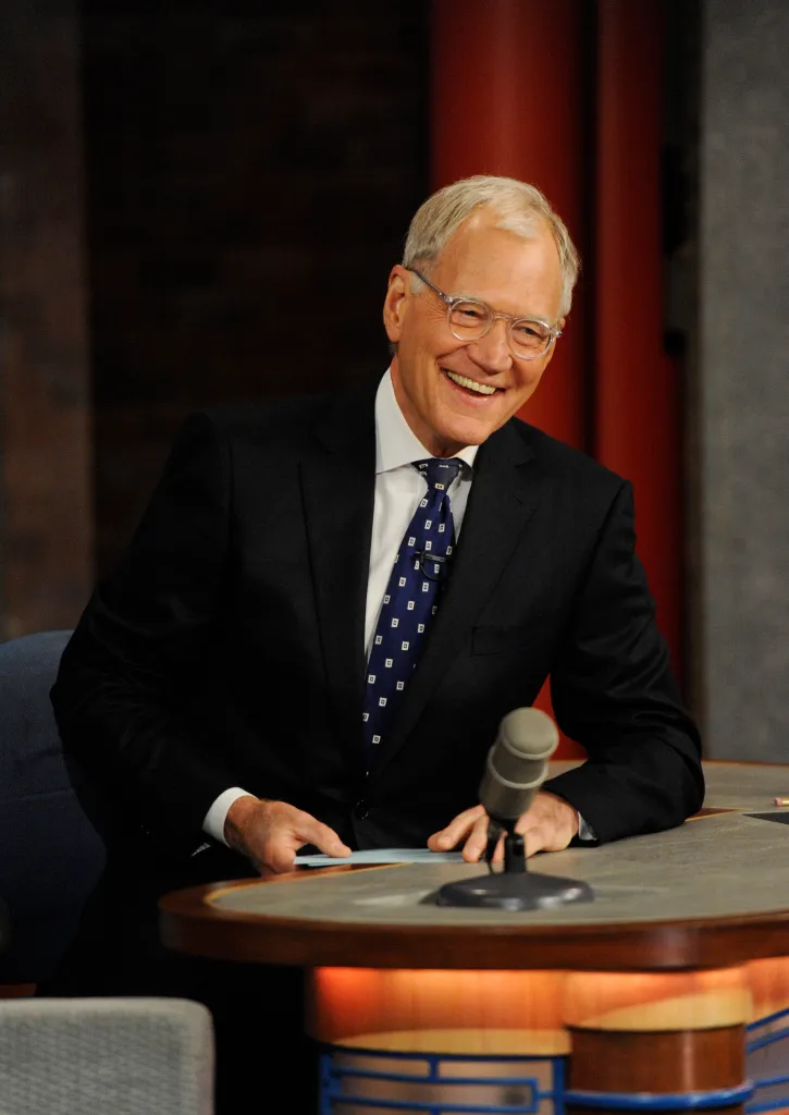 David Letterman smiles while hosting the Late Show.