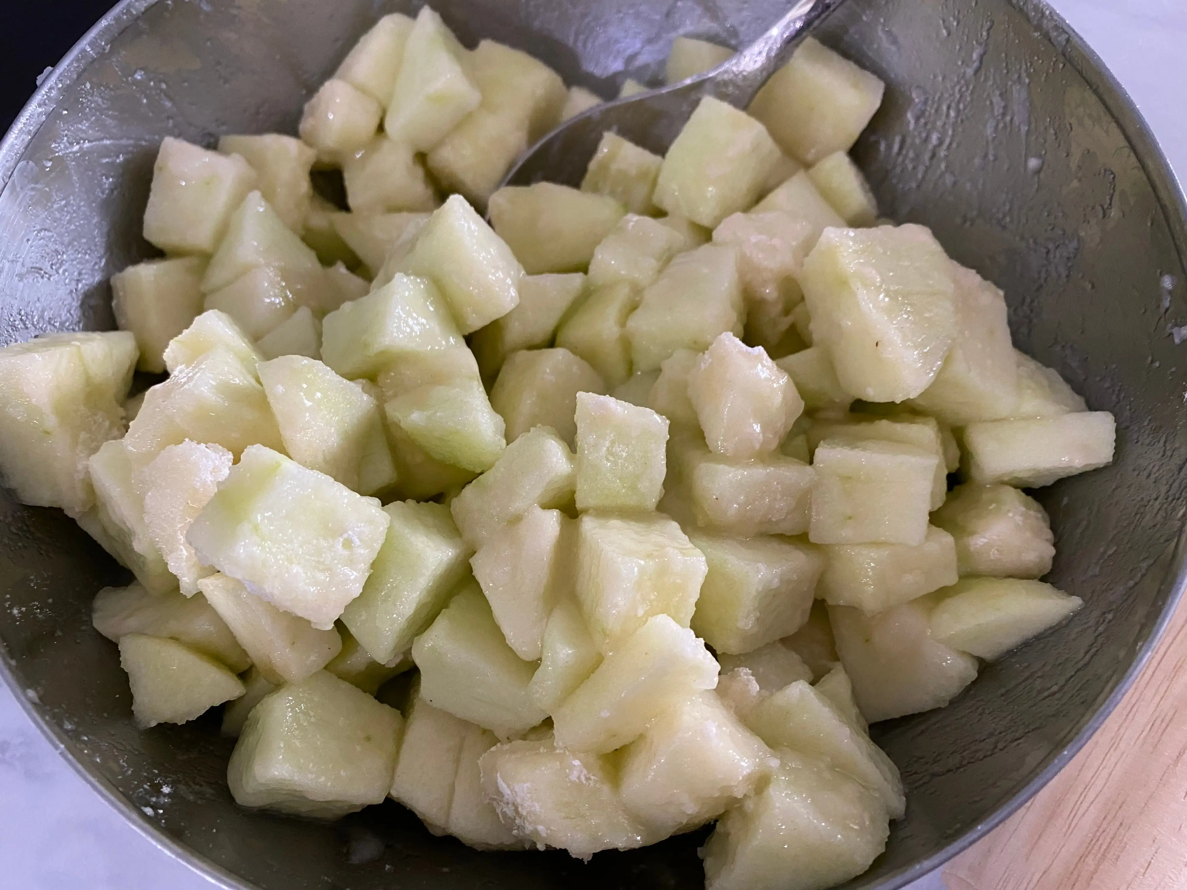 Chopped-up apples in a bowl.