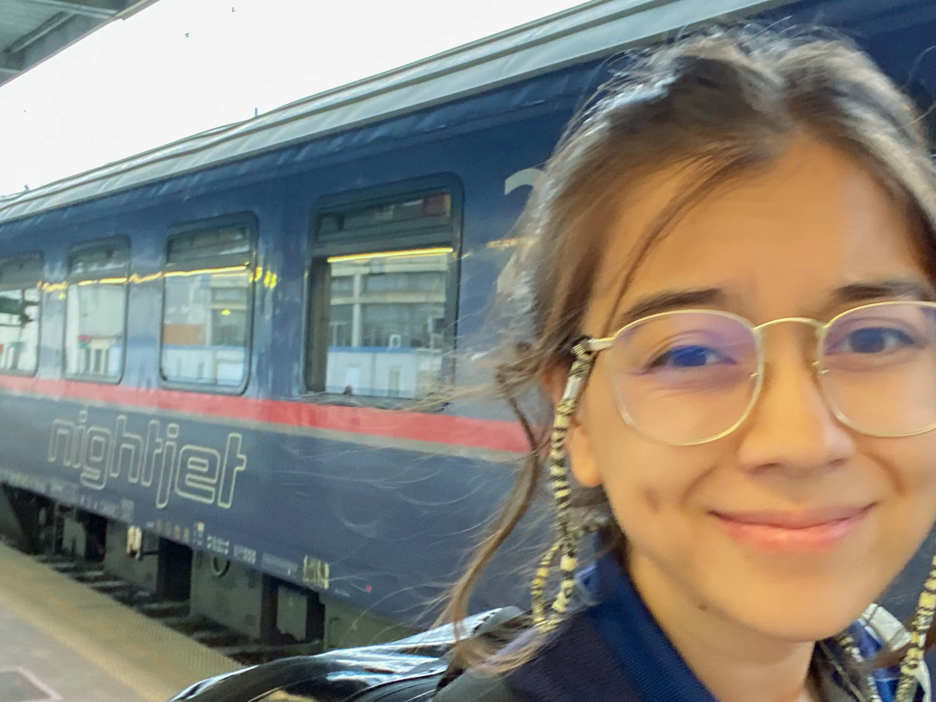 The author smiles after getting off an overnight train.