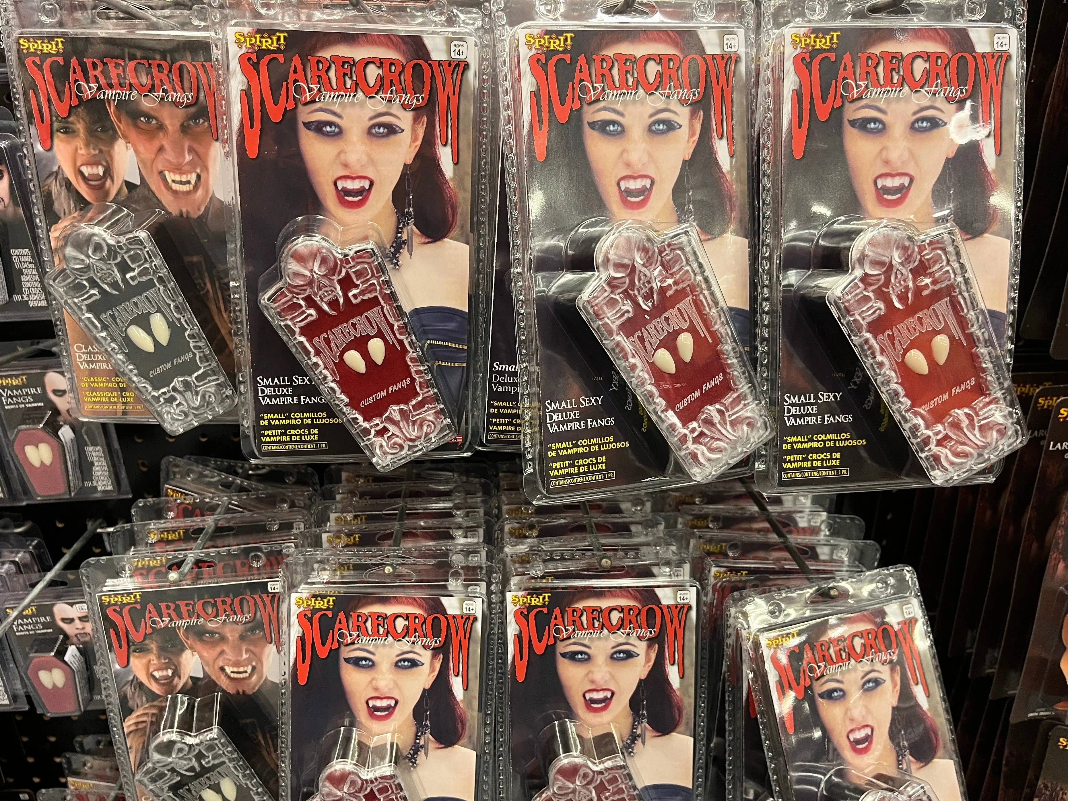 Packages of Scarecrow-brand vampire fangs on display at Spirit Halloween.