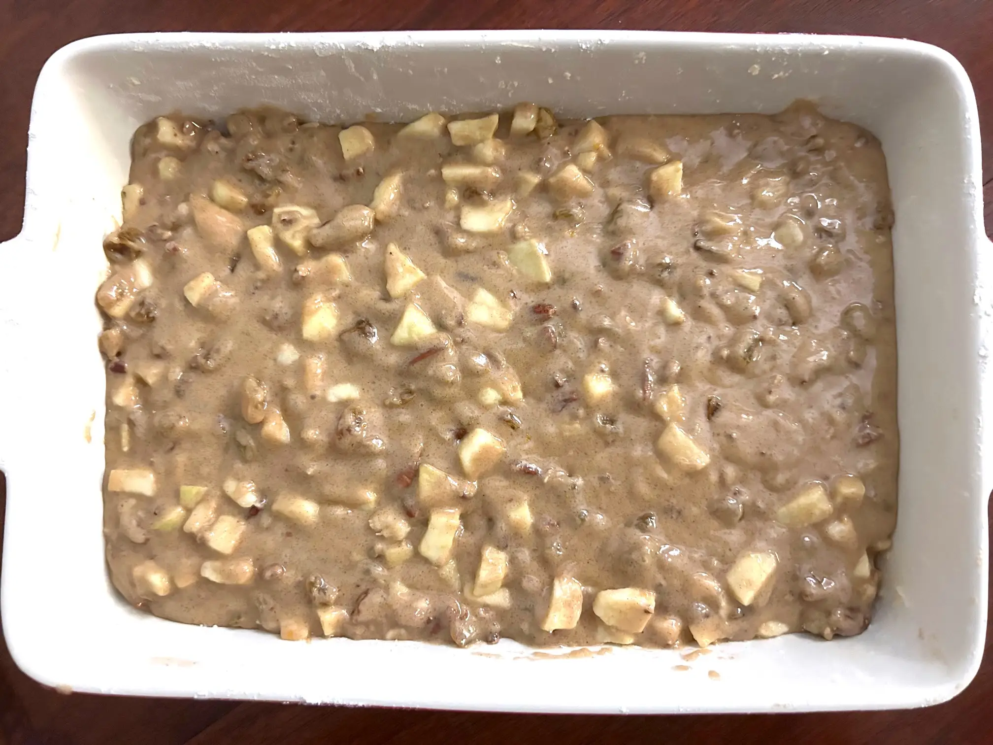 Adding batter to pan for Ina Garten's Apple Spice Cake