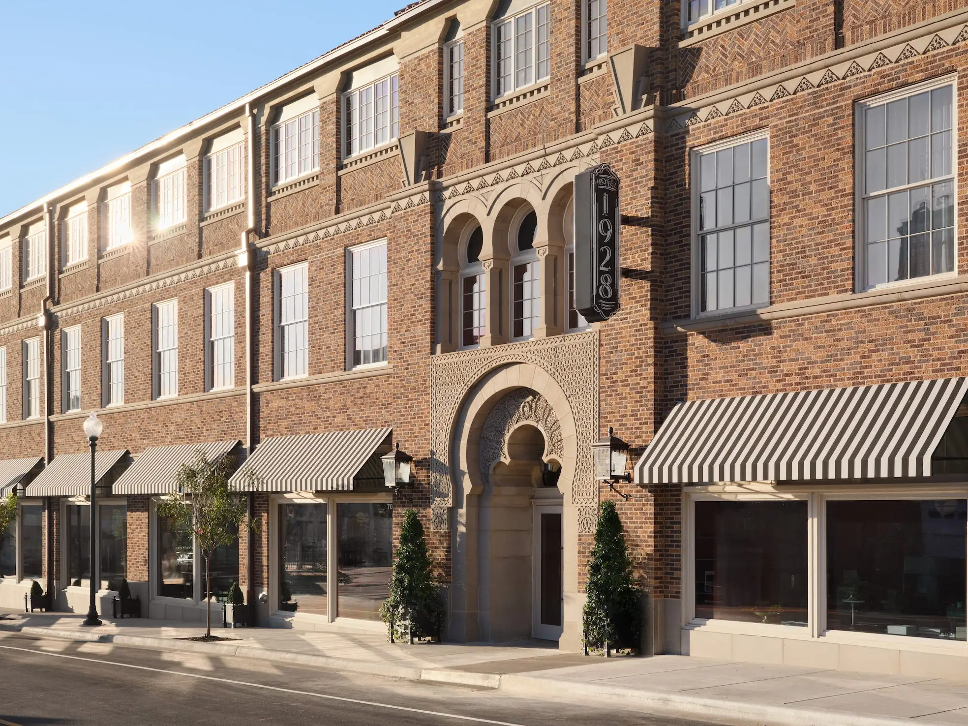 The exterior of a hotel with a sign that says 