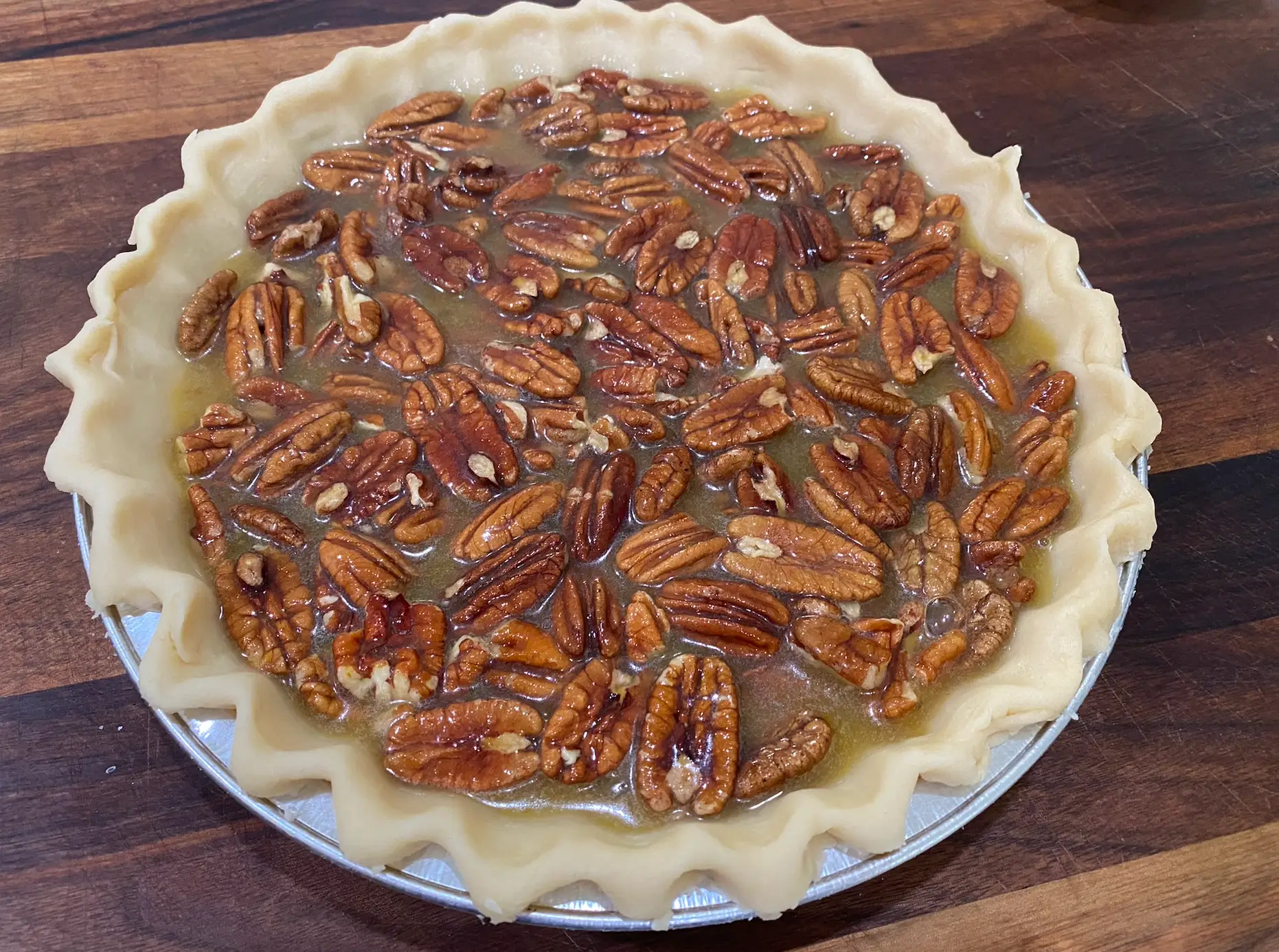 unbaked pecan pie ready to go into the oven