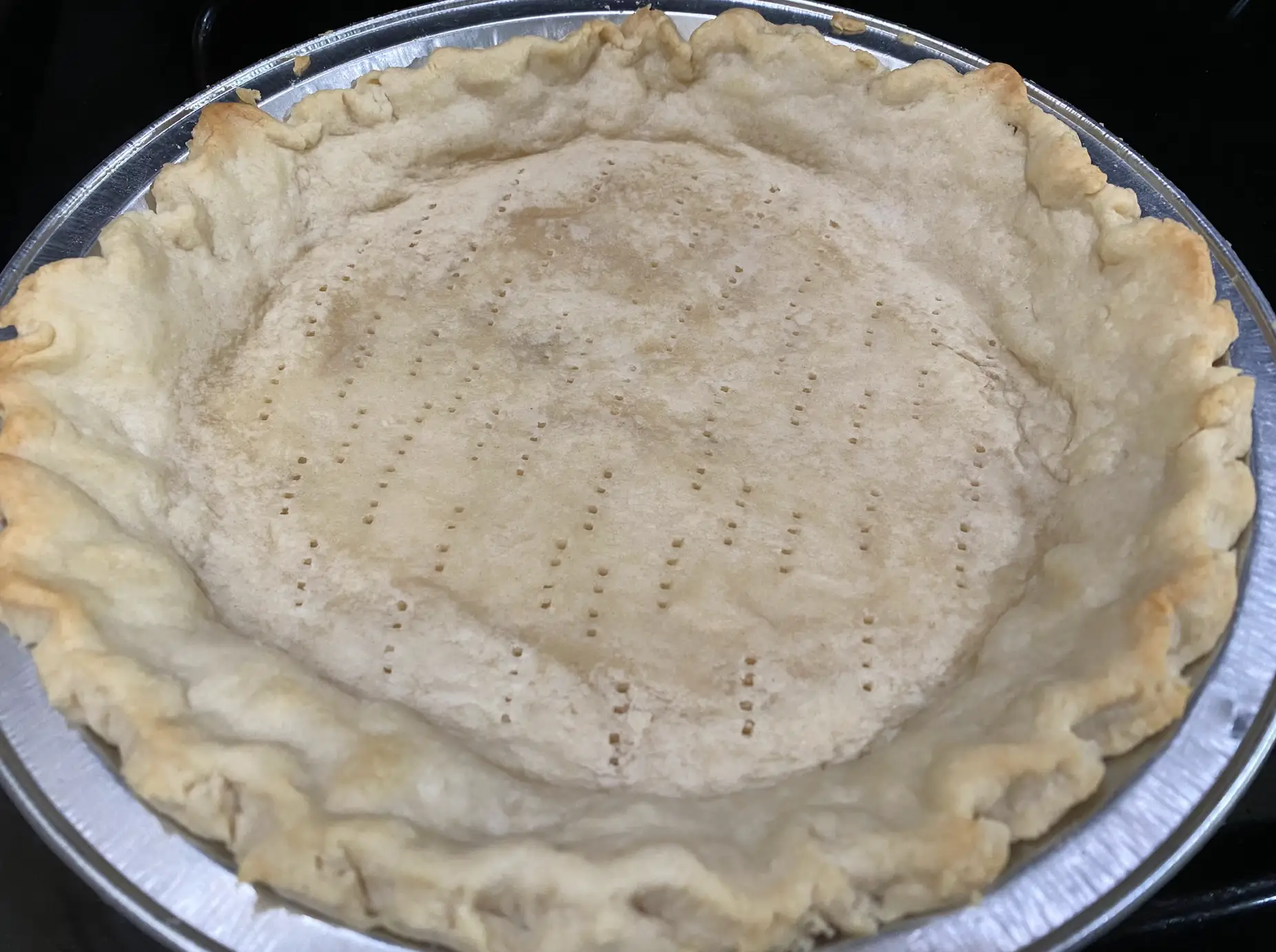 blind-baked empty pie shell in a pie tin