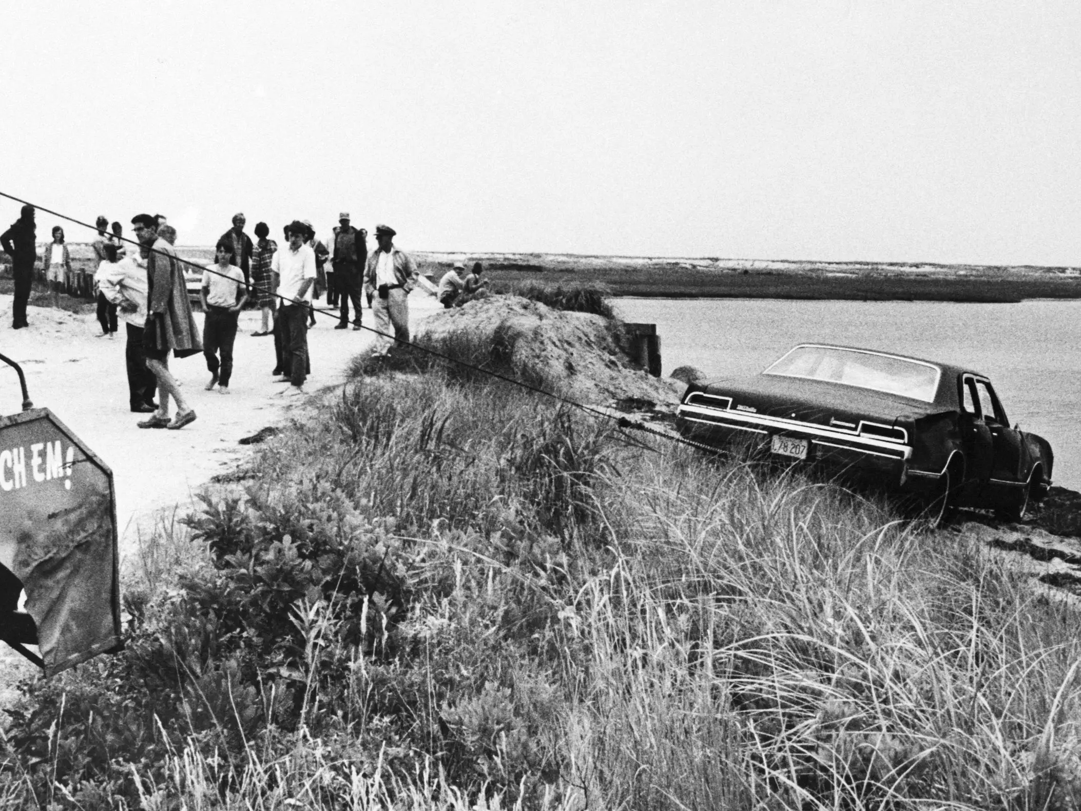 A tow truck pulls Senator Edward Kennedy's car out of Poucha Pond after the Senator's infamous accident on Chappaquiddick Island in 1969.
