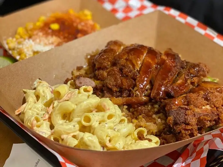 A box filled with macaroni and chicken katsu.