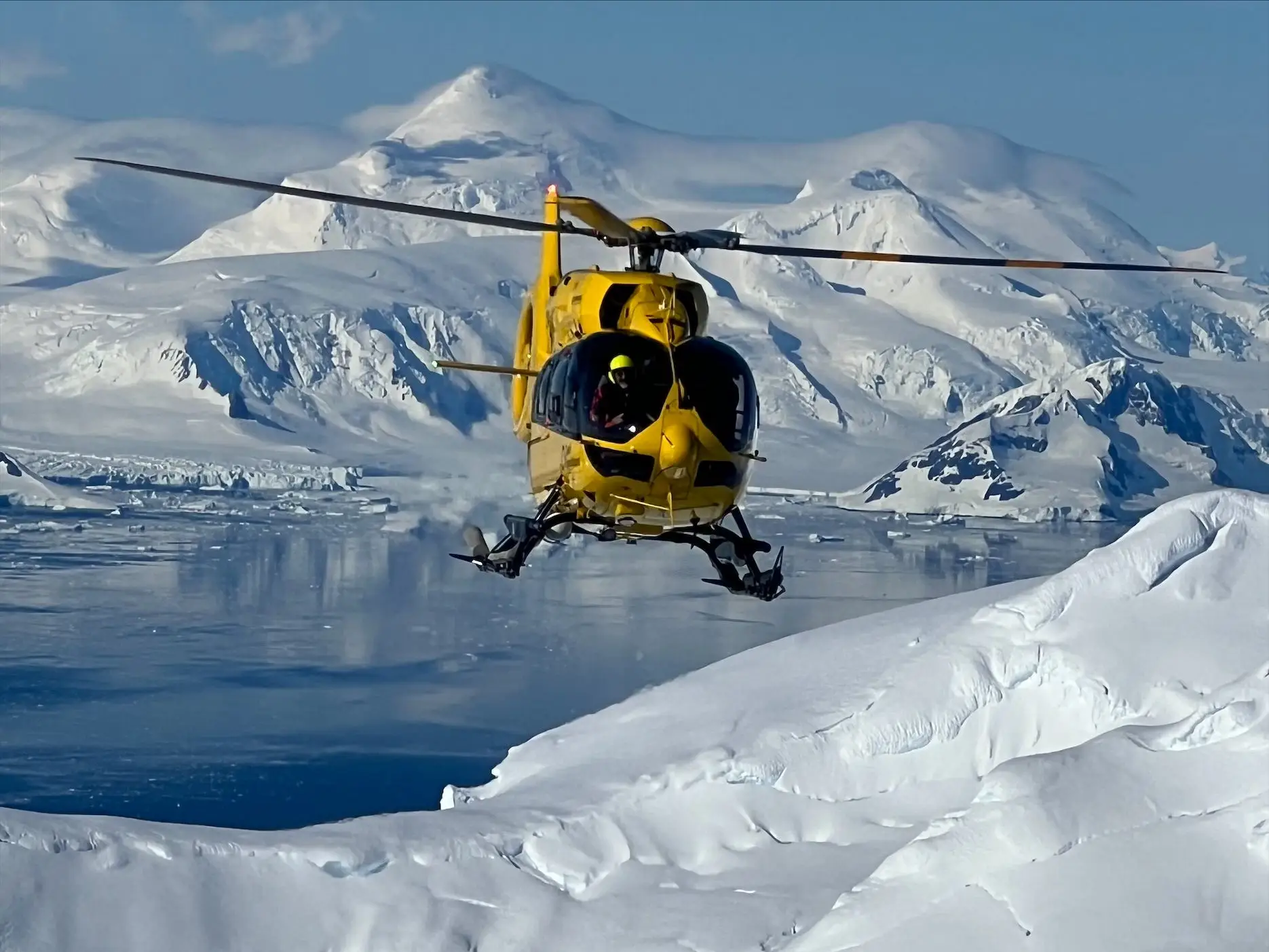 Quark helicopter flying over Antarctica.