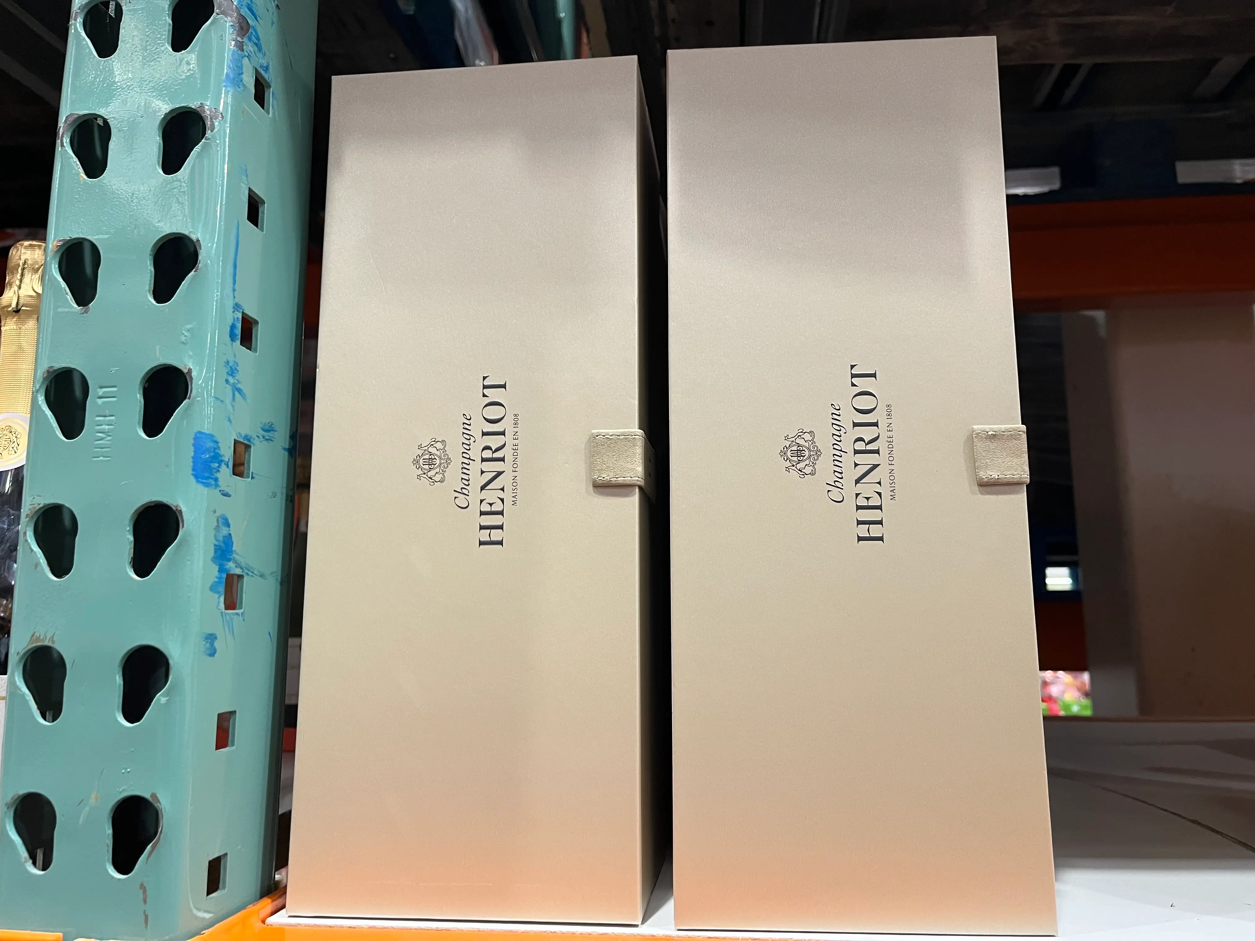 boxes of vintage champagne on the shelves at Costco