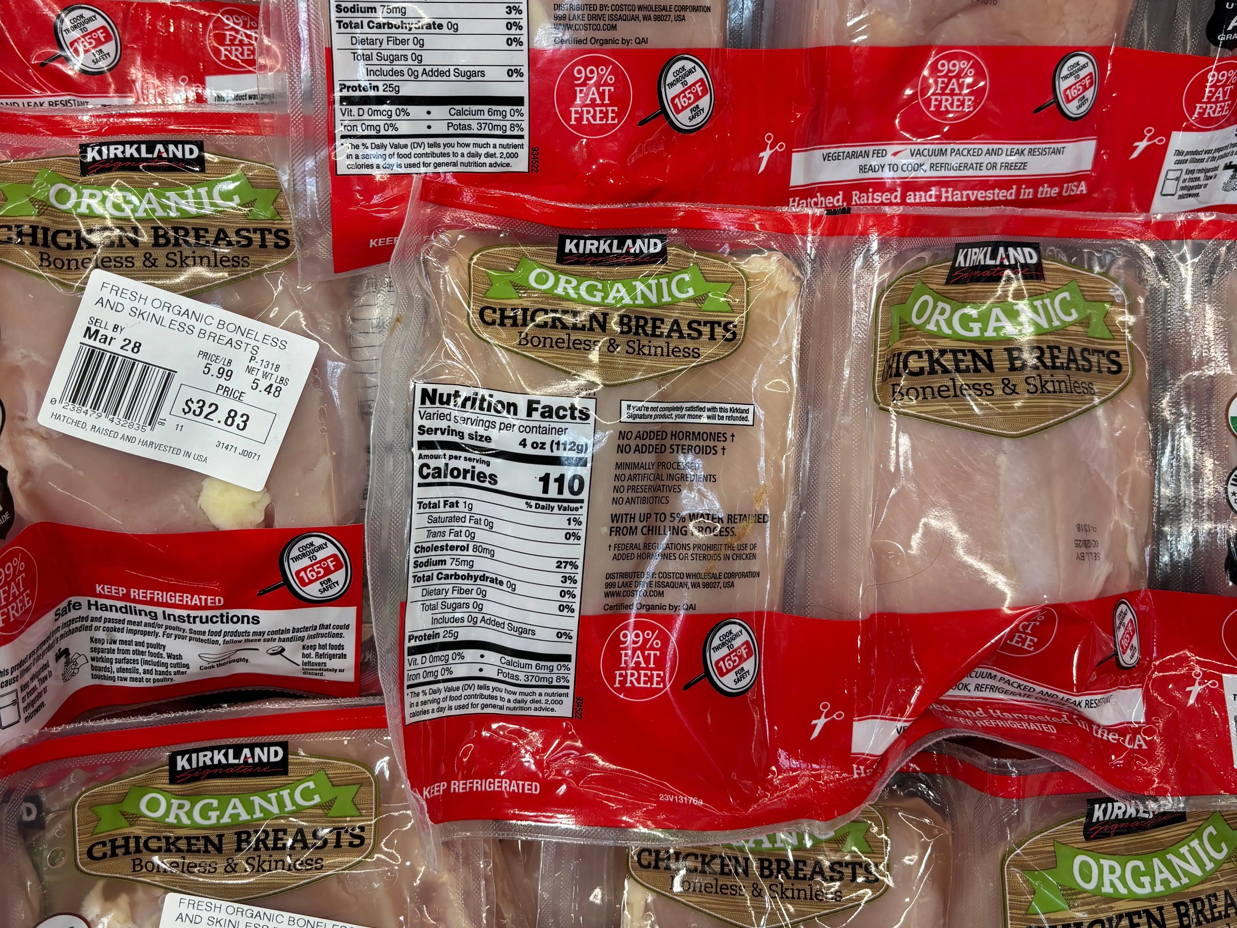 Packages of Kirkland organic chicken breasts.