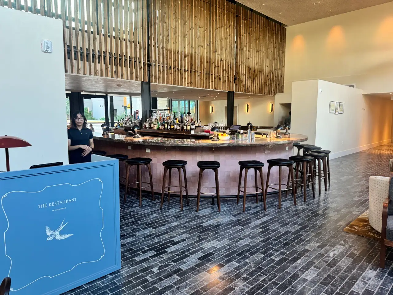 Empty rounded bar area inside The Restaurant at The Albert