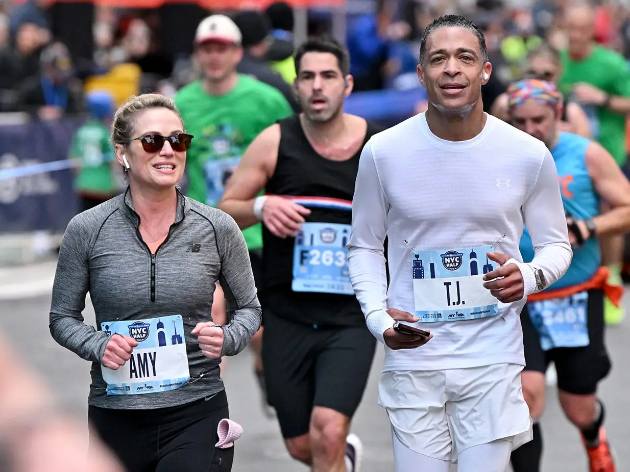 Amy Robach and T.J. Holmes participate in the United Airlines NYC Half Marathon on March 17, 2024 in New York City. The course starts in Brooklyn and ends in Central Park in Manhattan.