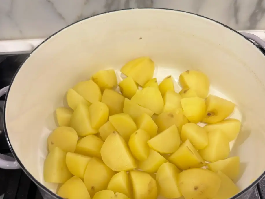 Yukon gold potatoes on a stove.
