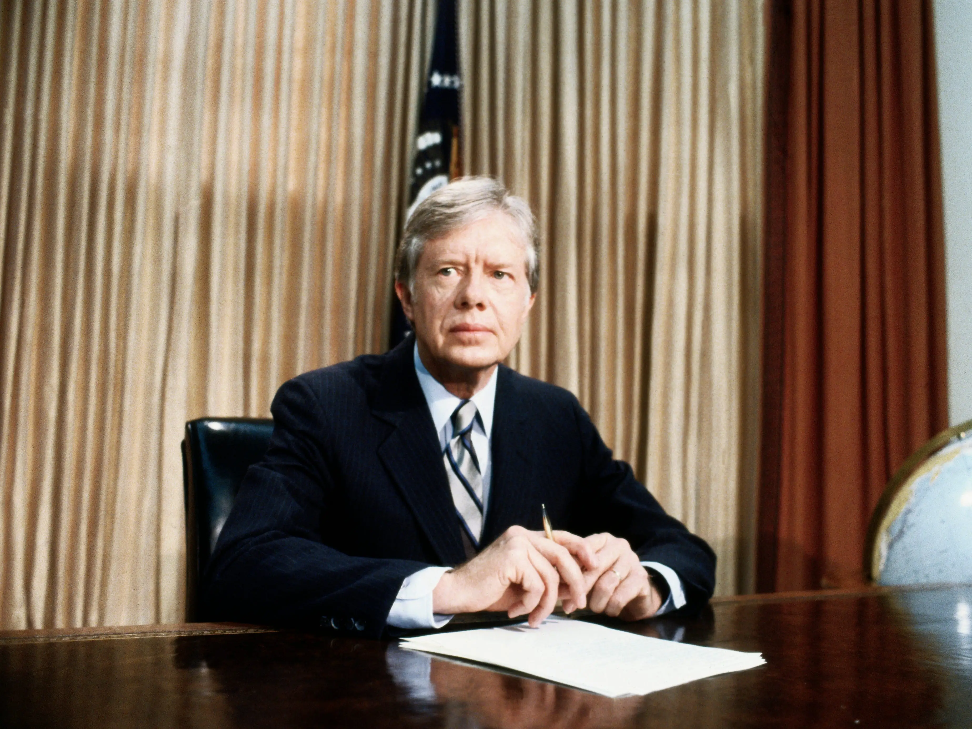 Jimmy Carter sits in the Oval Office during his presidency