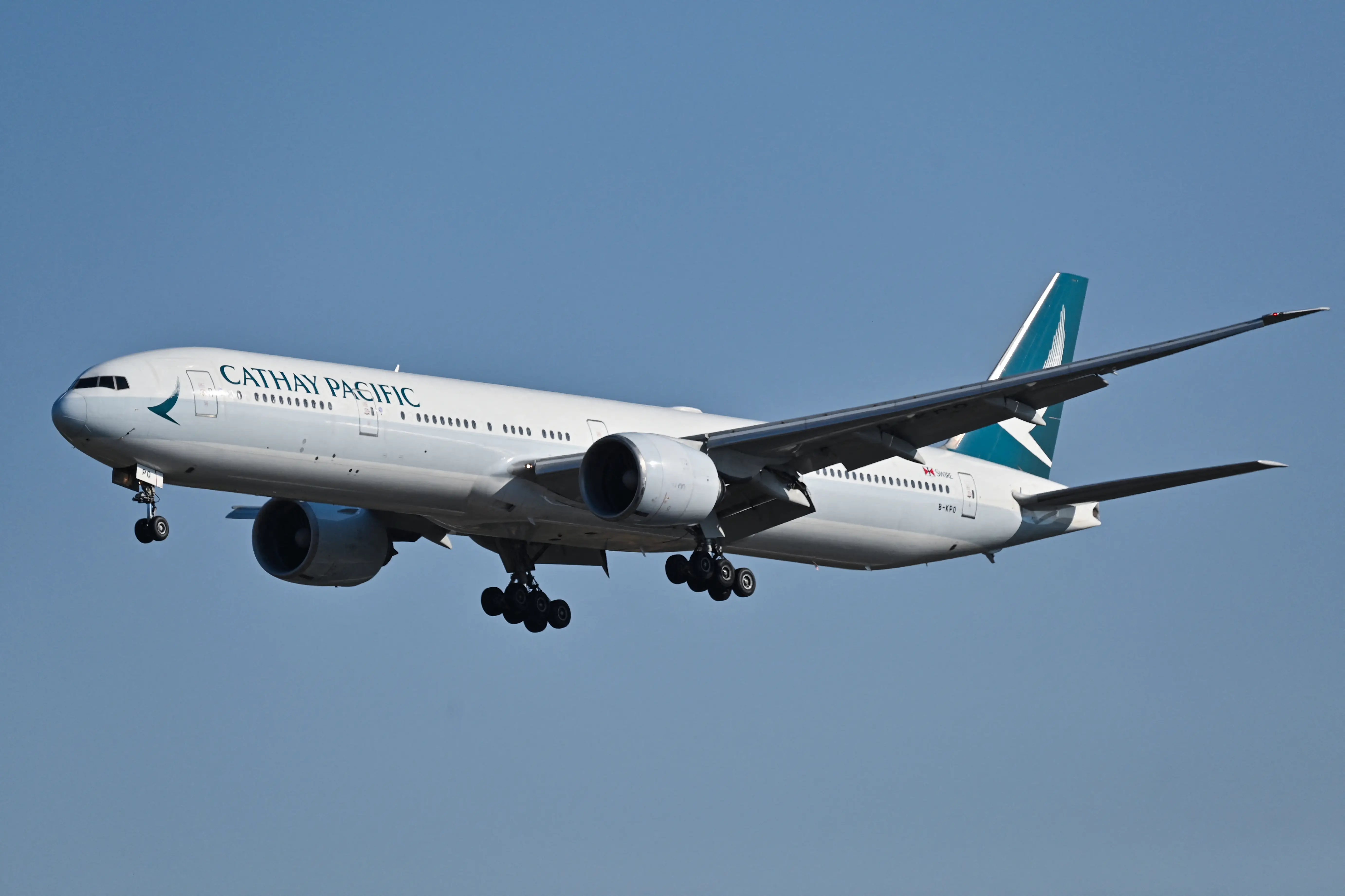 A Cathay Pacific Boeing 777-300ER plane prepares for landing at the Capital International airport in Beijing on October 22, 2024.