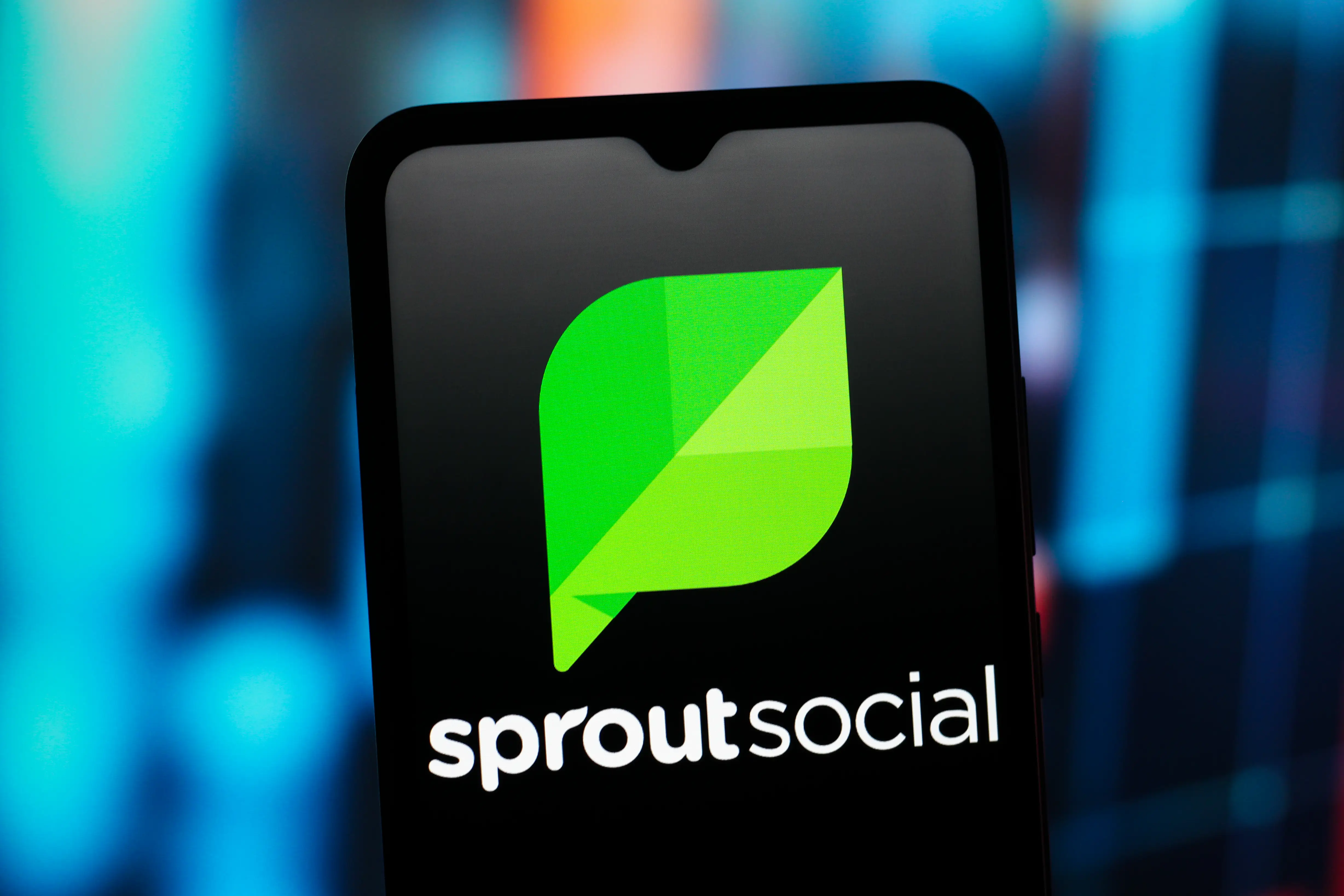 The Sprout Social logo appears on a phone screen.