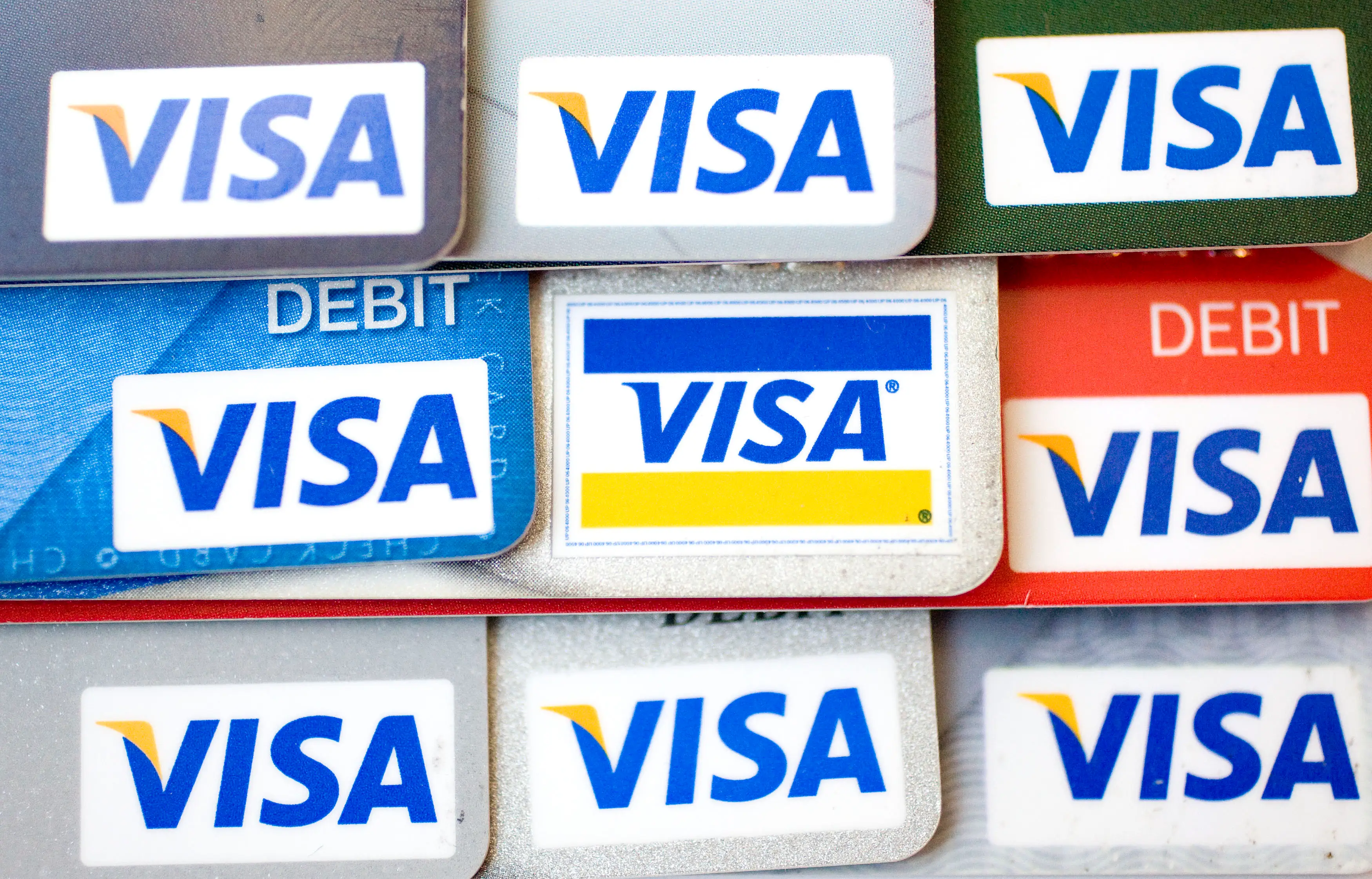 A stack of Visa credit cards.