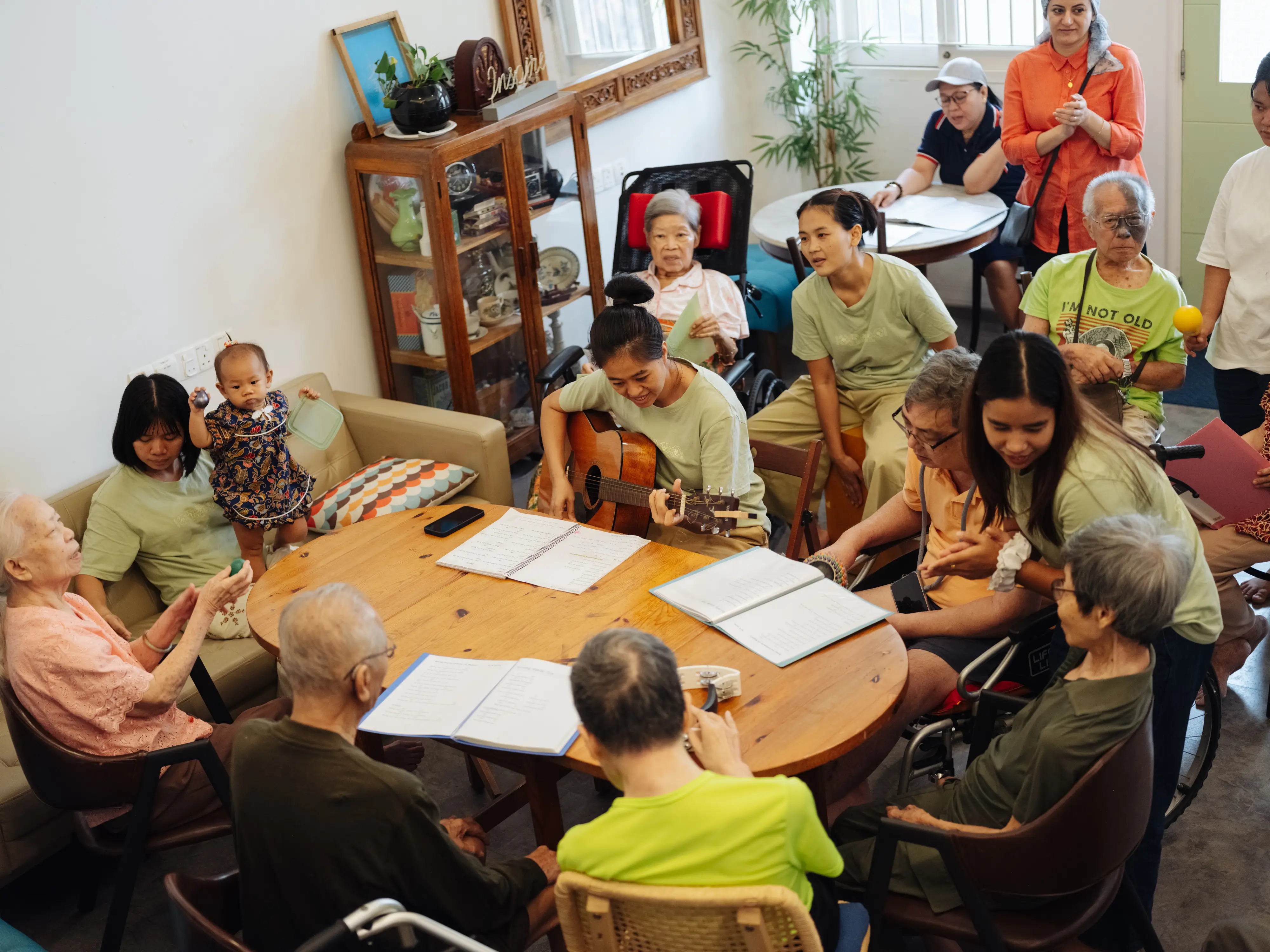 The caregivers are also multitalented, play instruments for the residents during their activities.