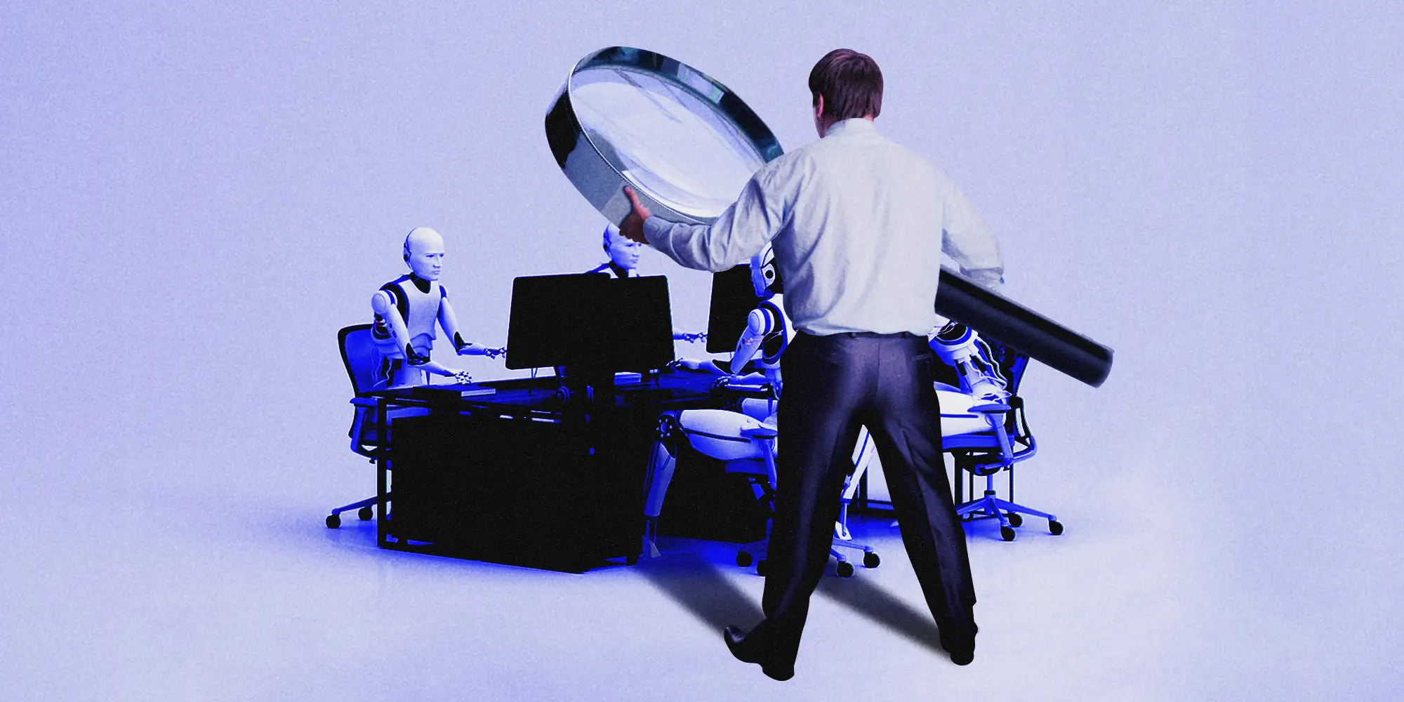 Manager holding a giant magnifying glass over humanoid robots working at a desk with computer monitors.