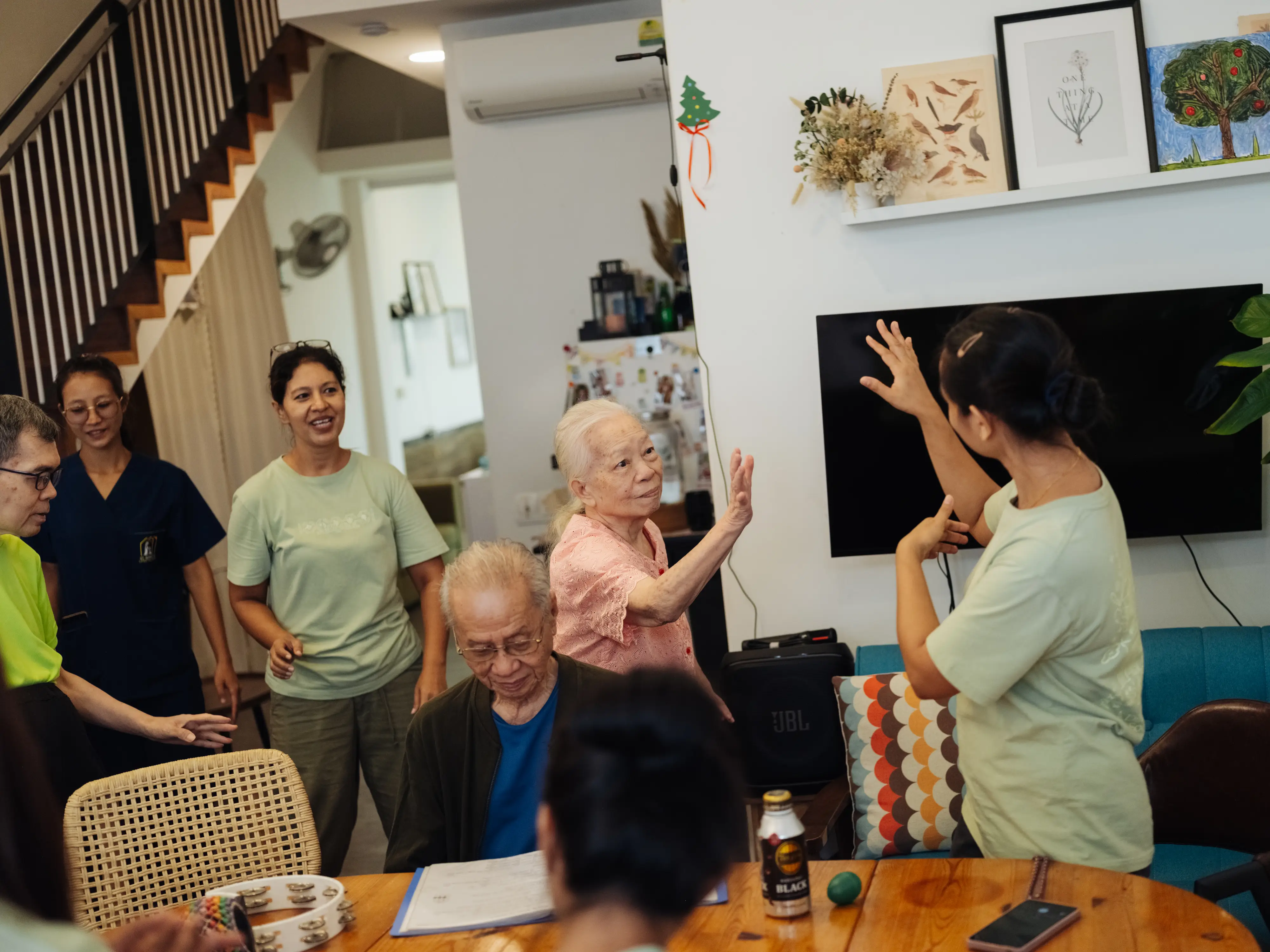 A resident high-fiving an employee.