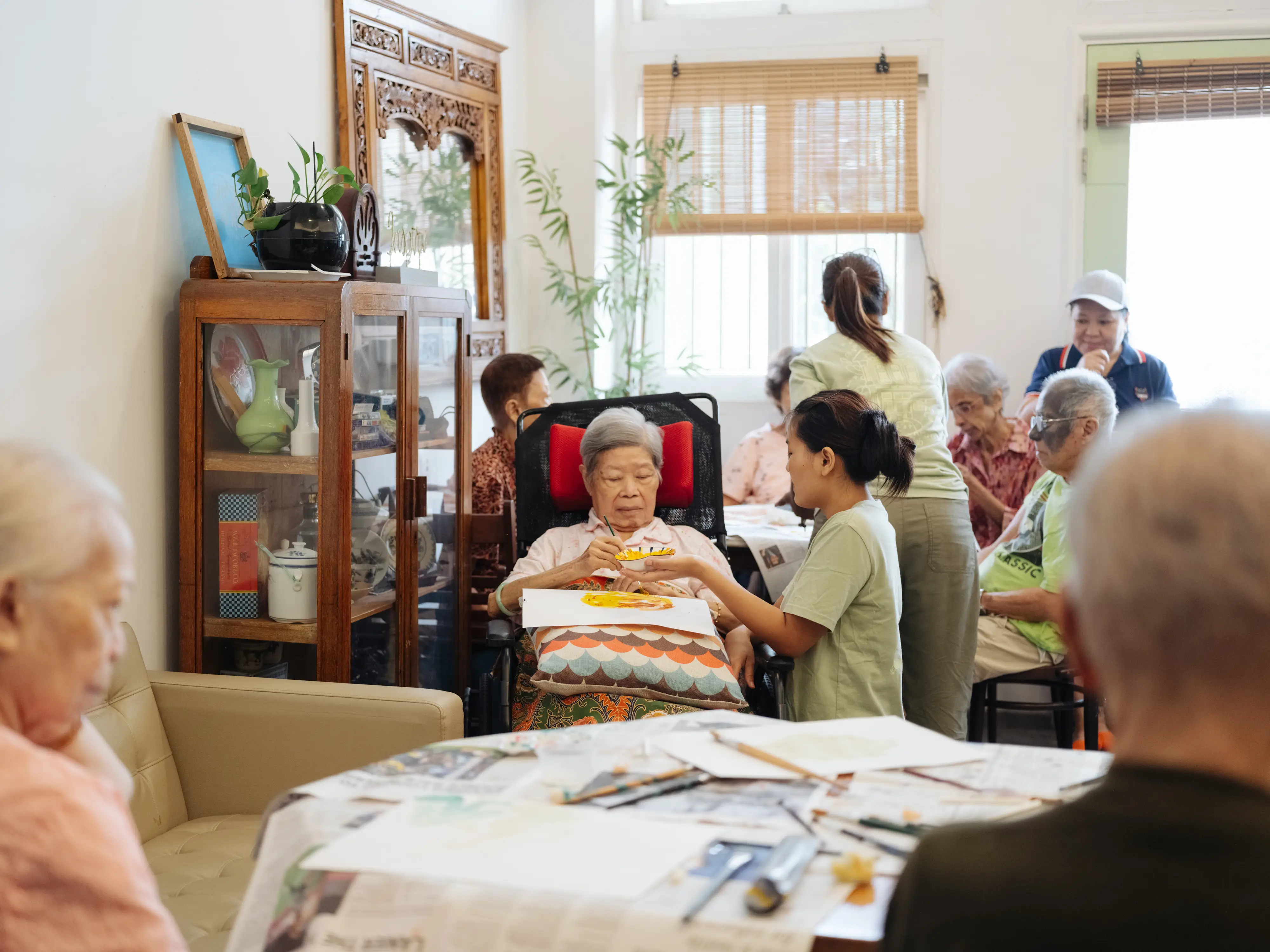 A caregiver helping a resident during a session.