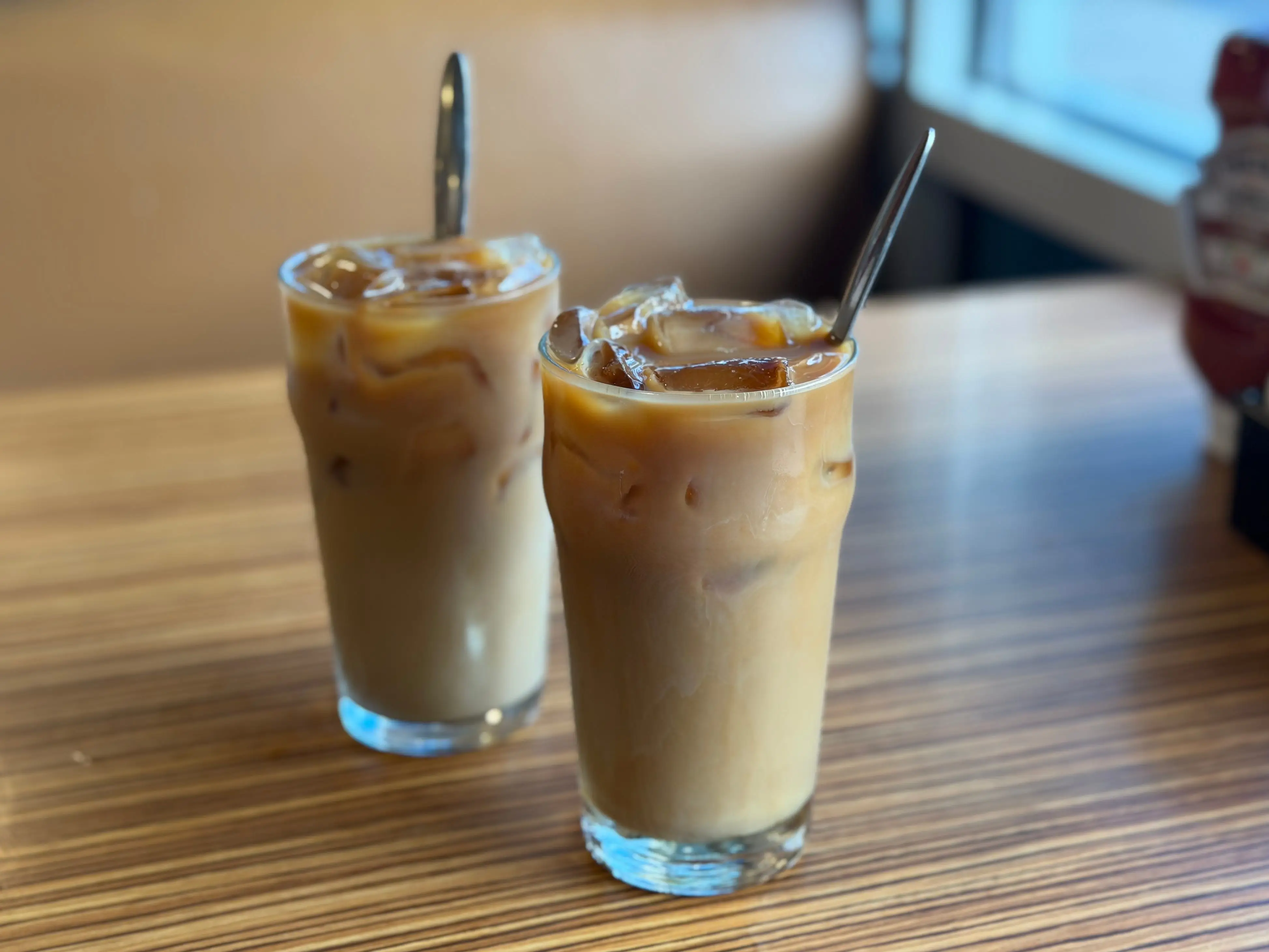 Two iced coffees on a table.