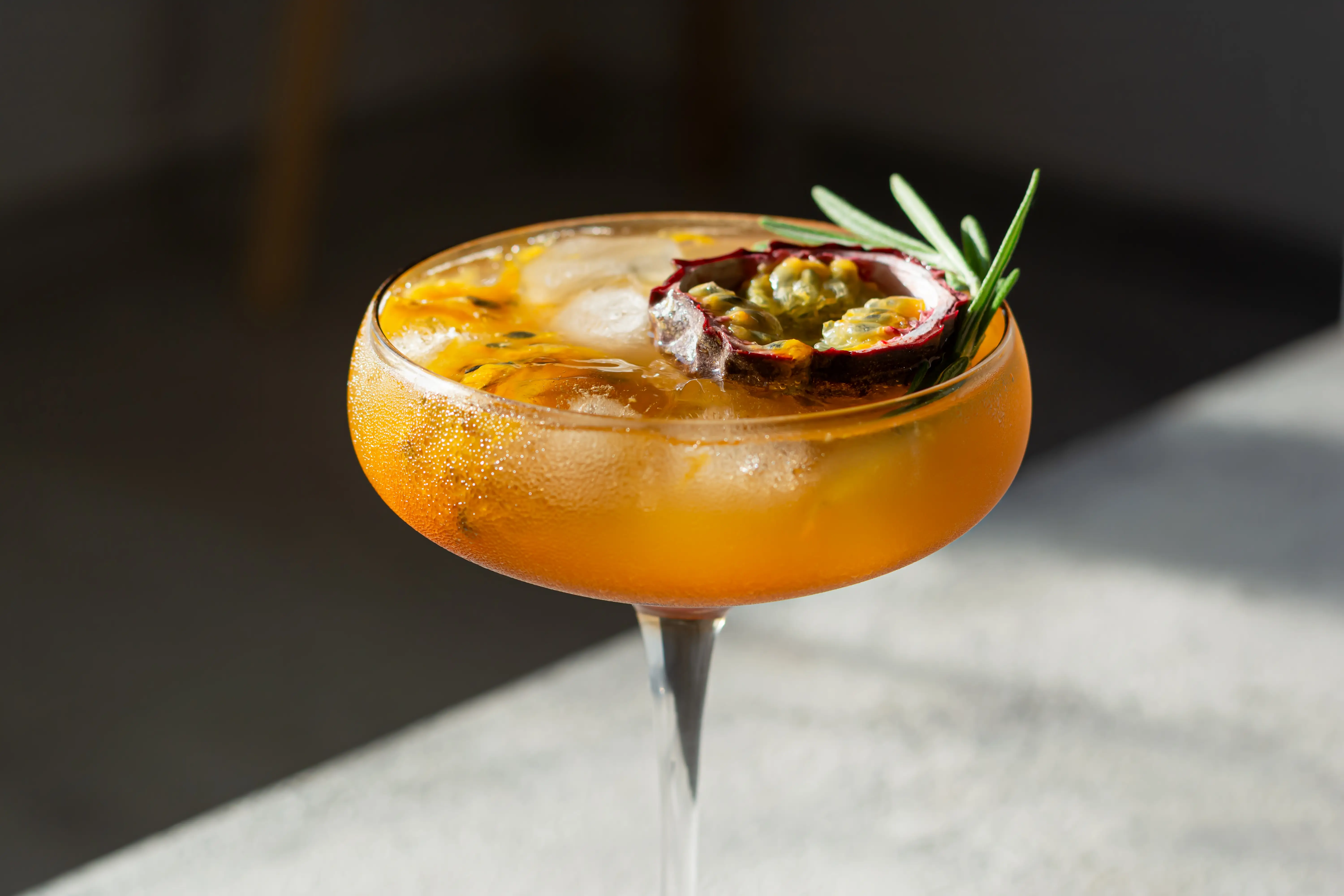 ced drink with passion fruit and rosemary.