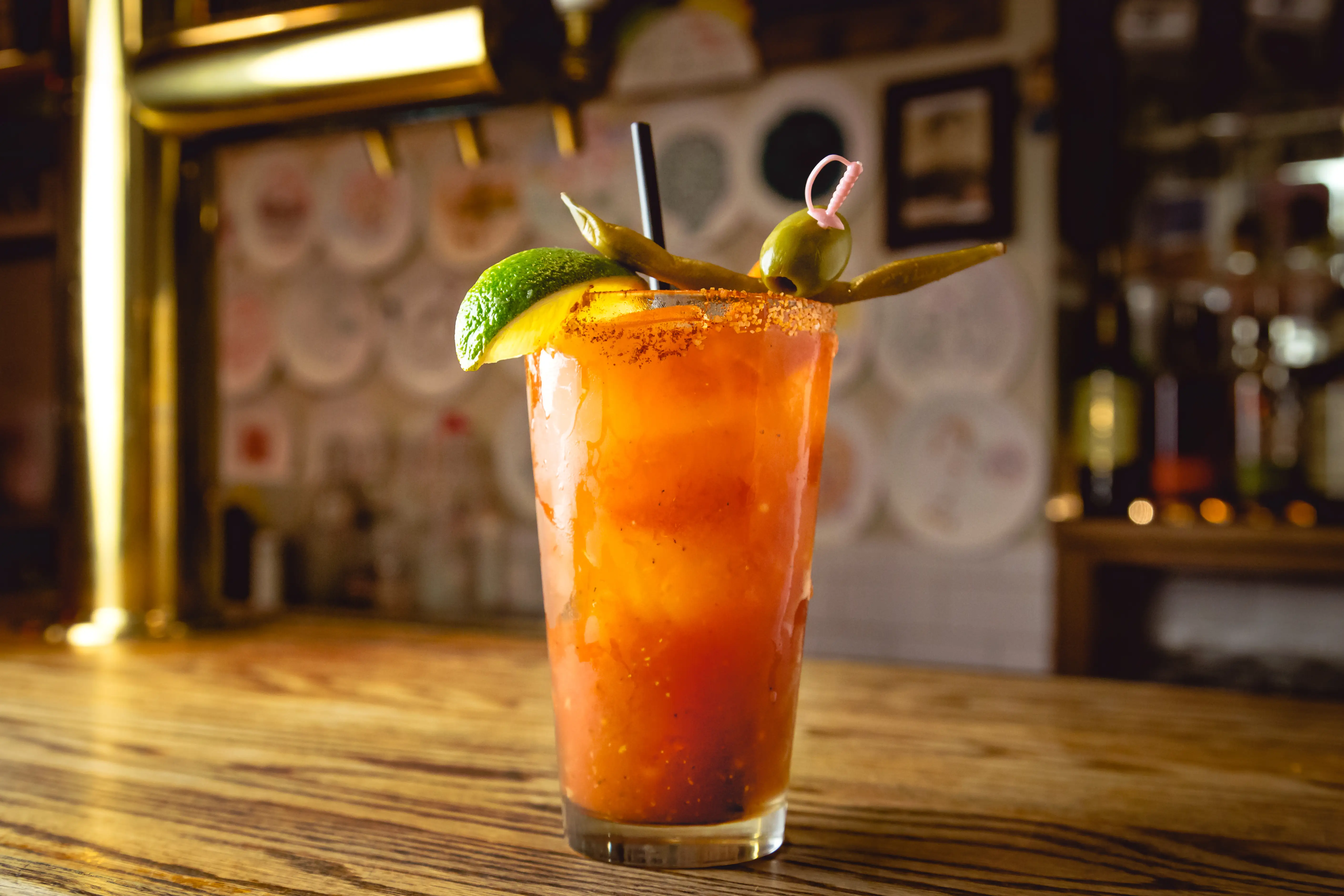 bloody mary with olive, lime on top