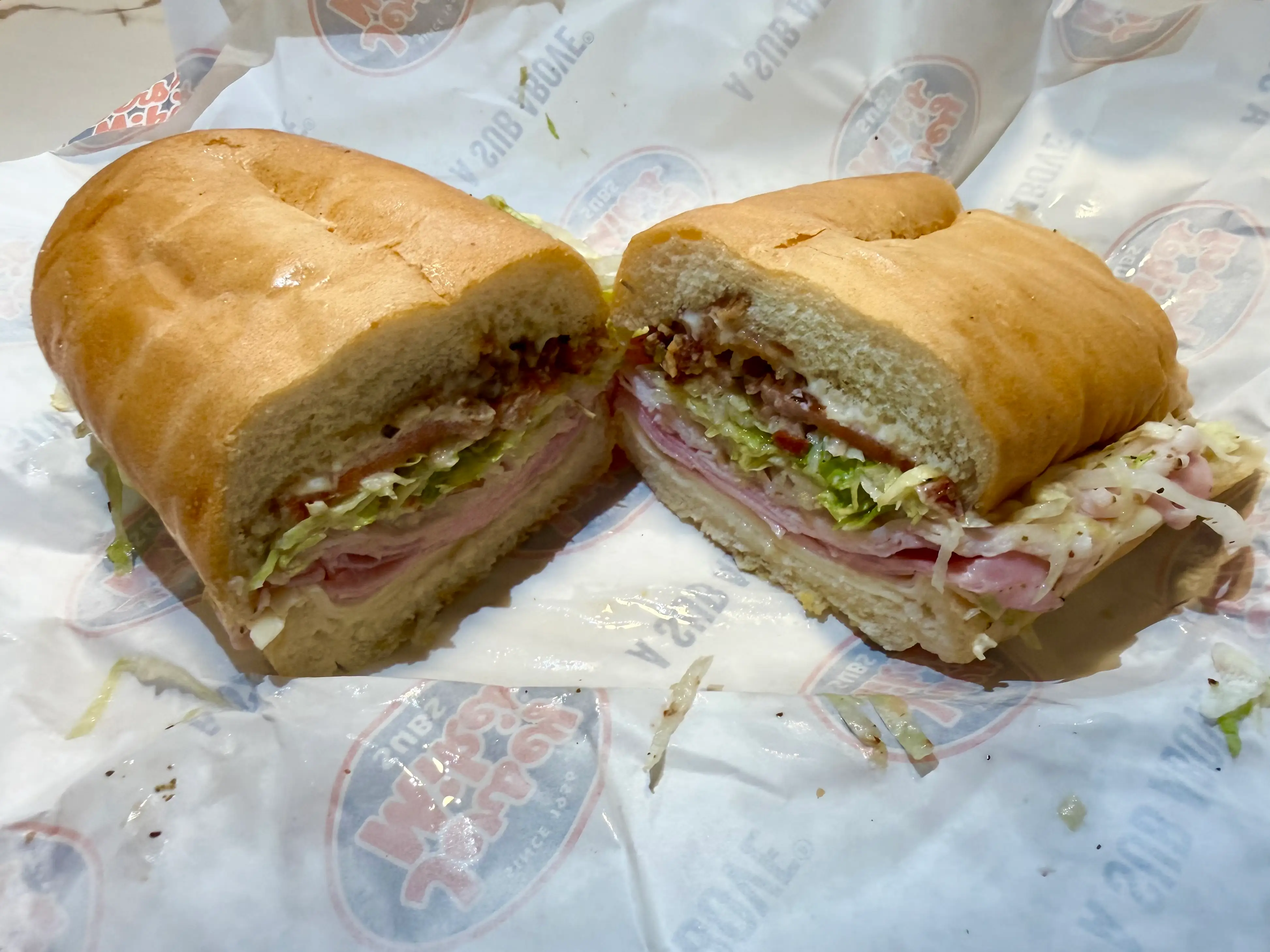 Jersey Mikes club sandwich in half