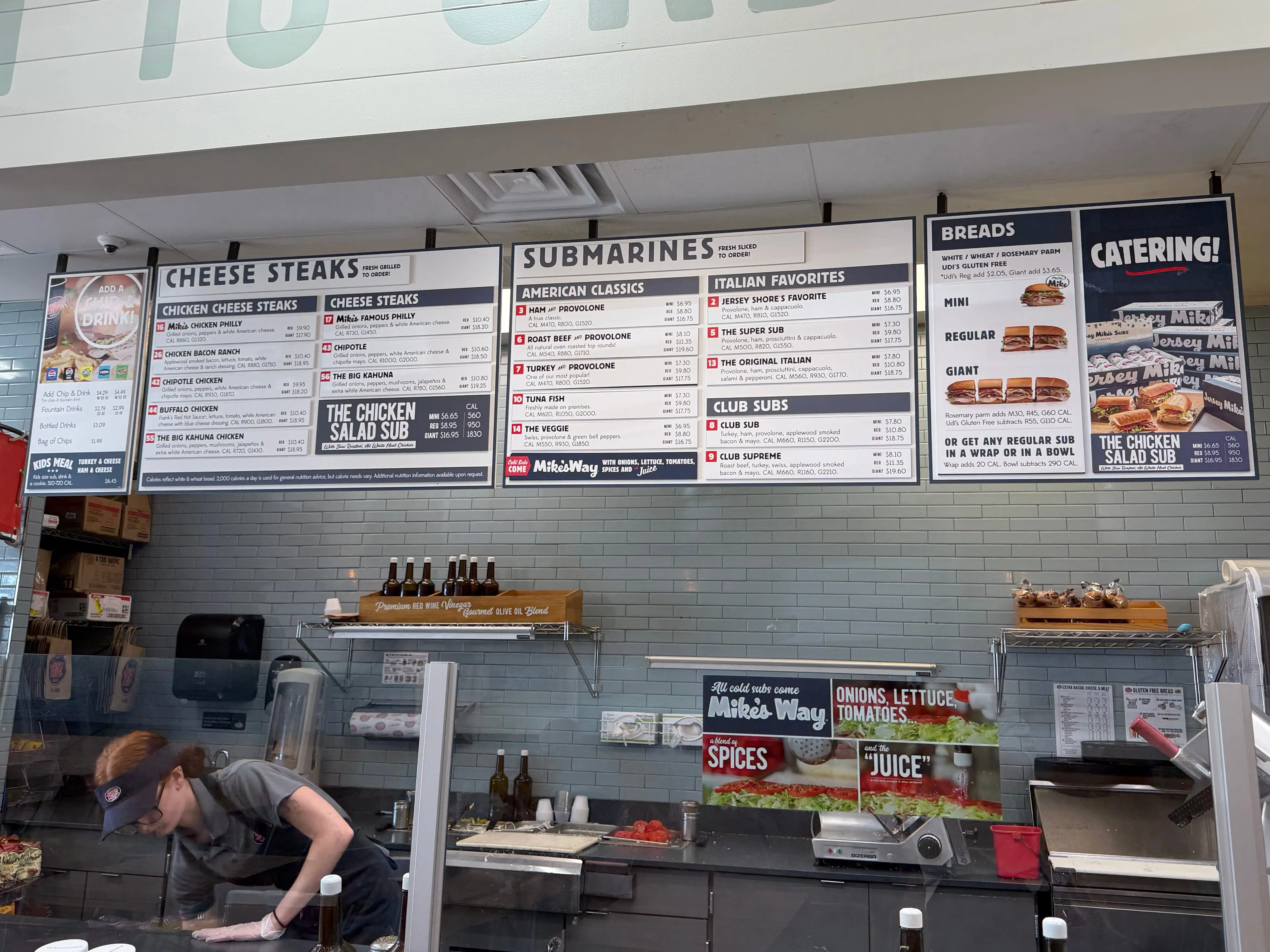 Jersey Mikes menu with cheesesteaks, submarines