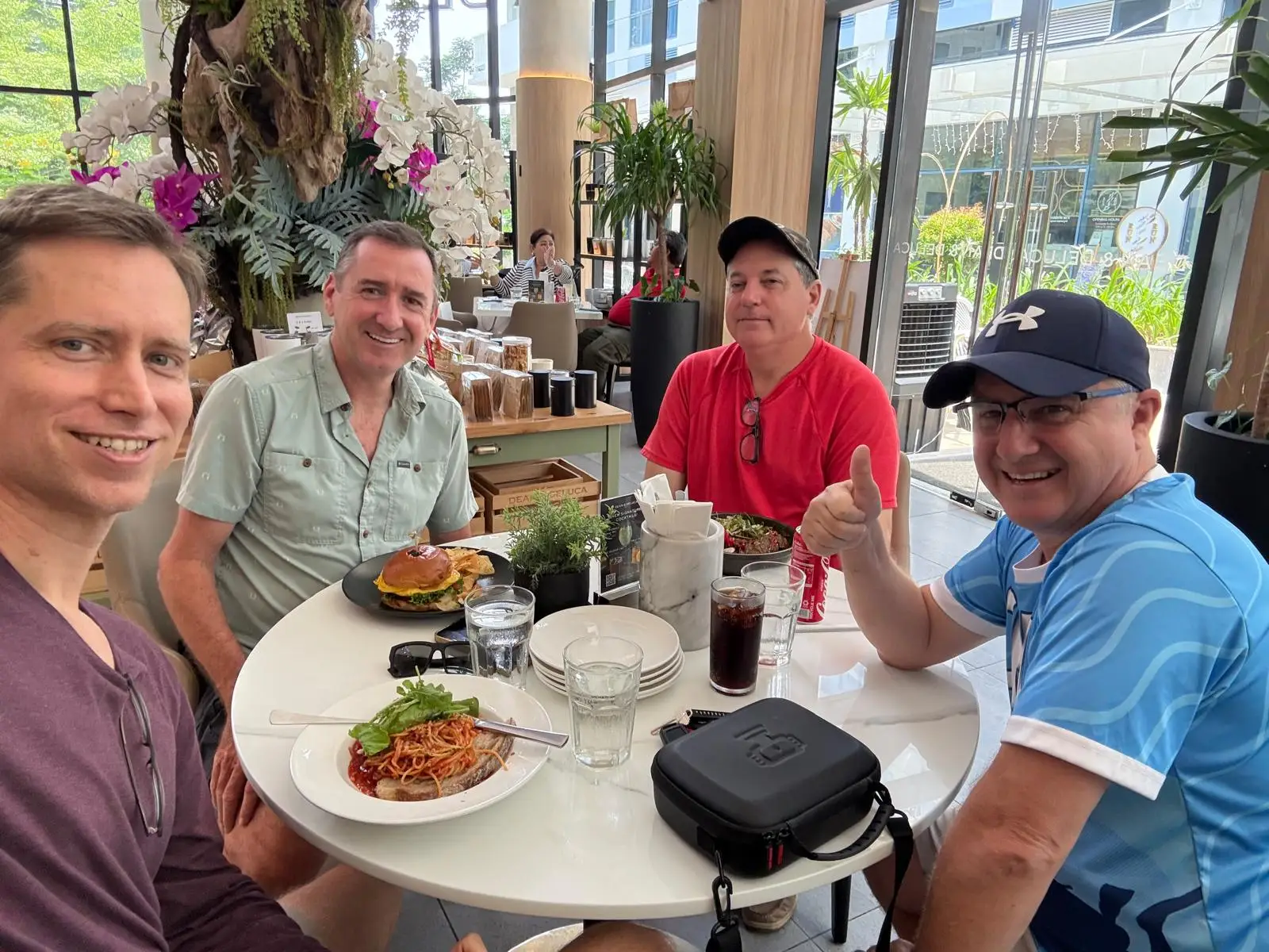 A group of friends sitign around the table.