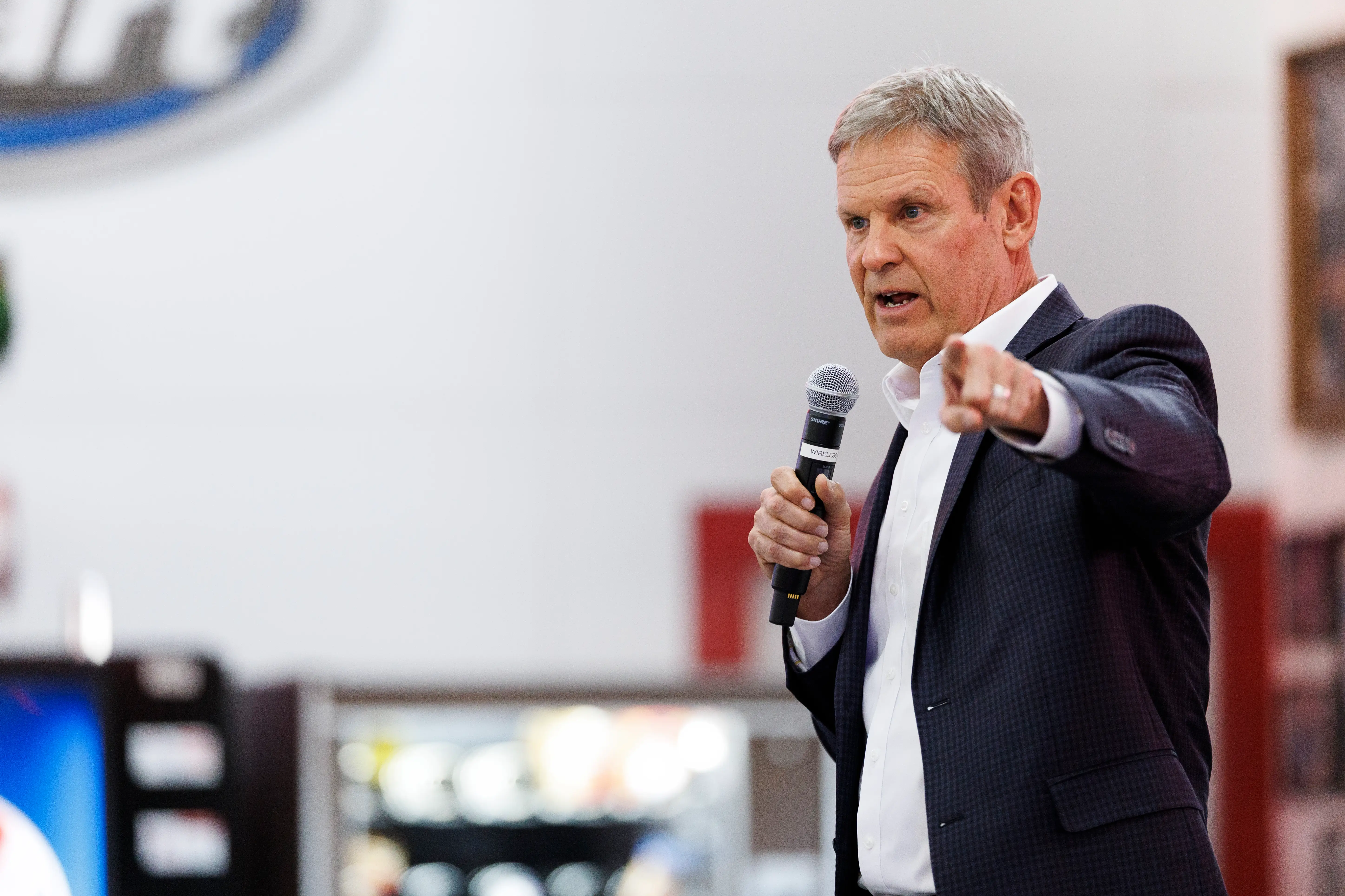 A man in a suit speaks.