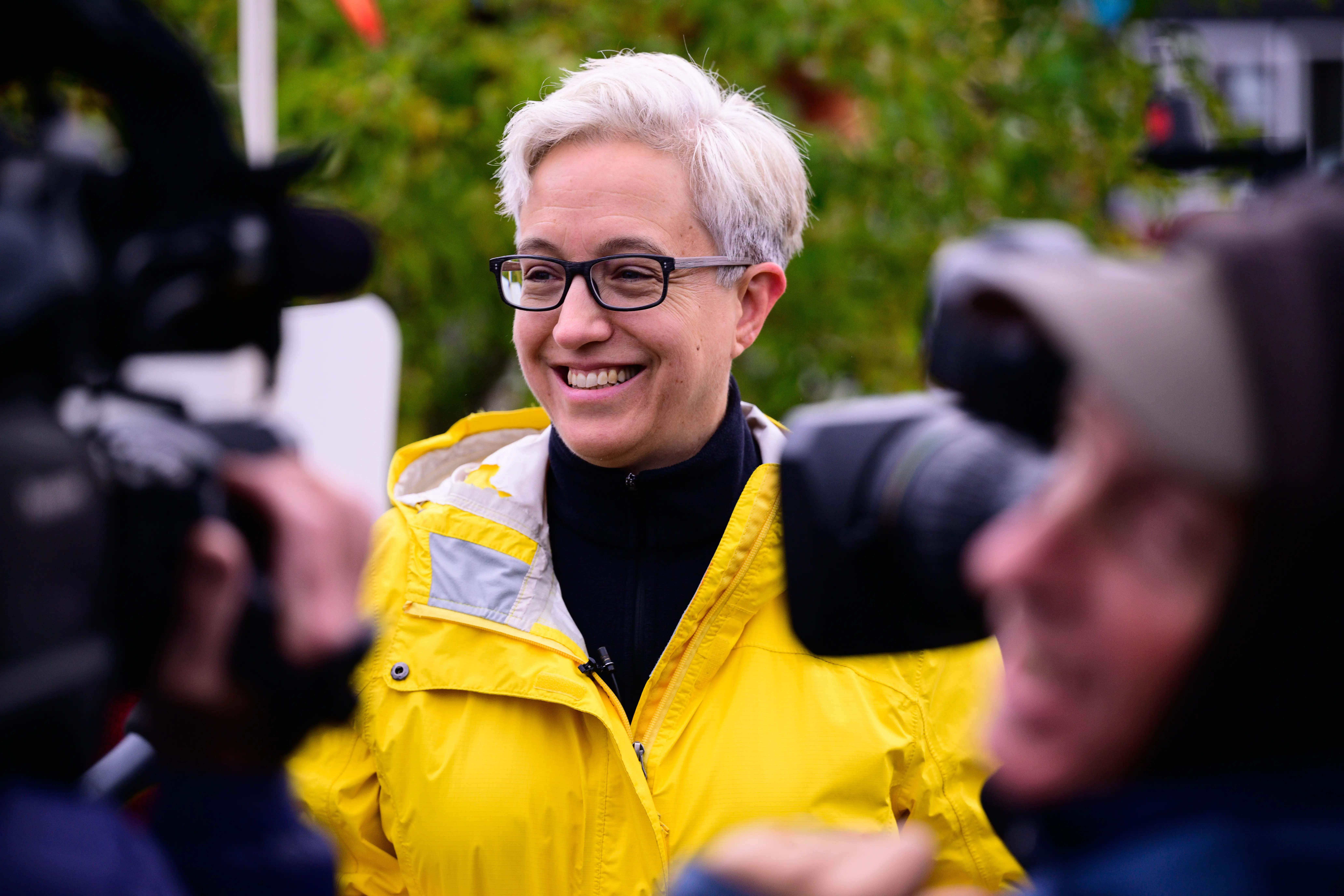 A woman in a raincoat.