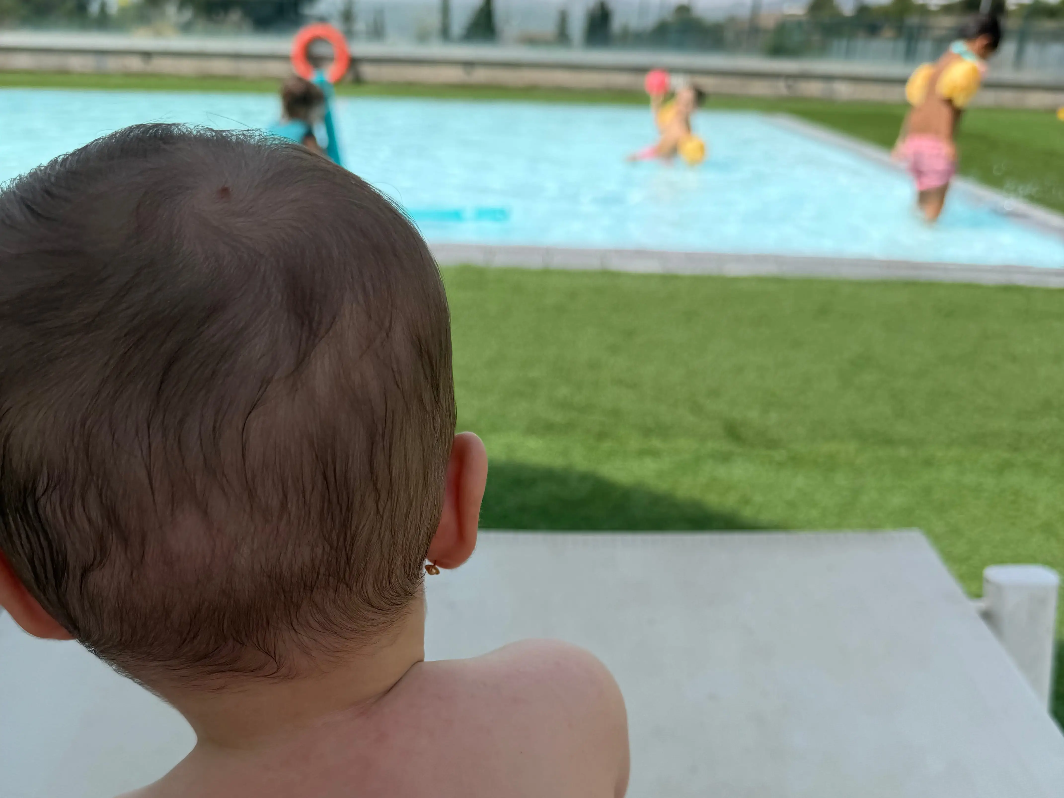 Kids playing in shallow pool