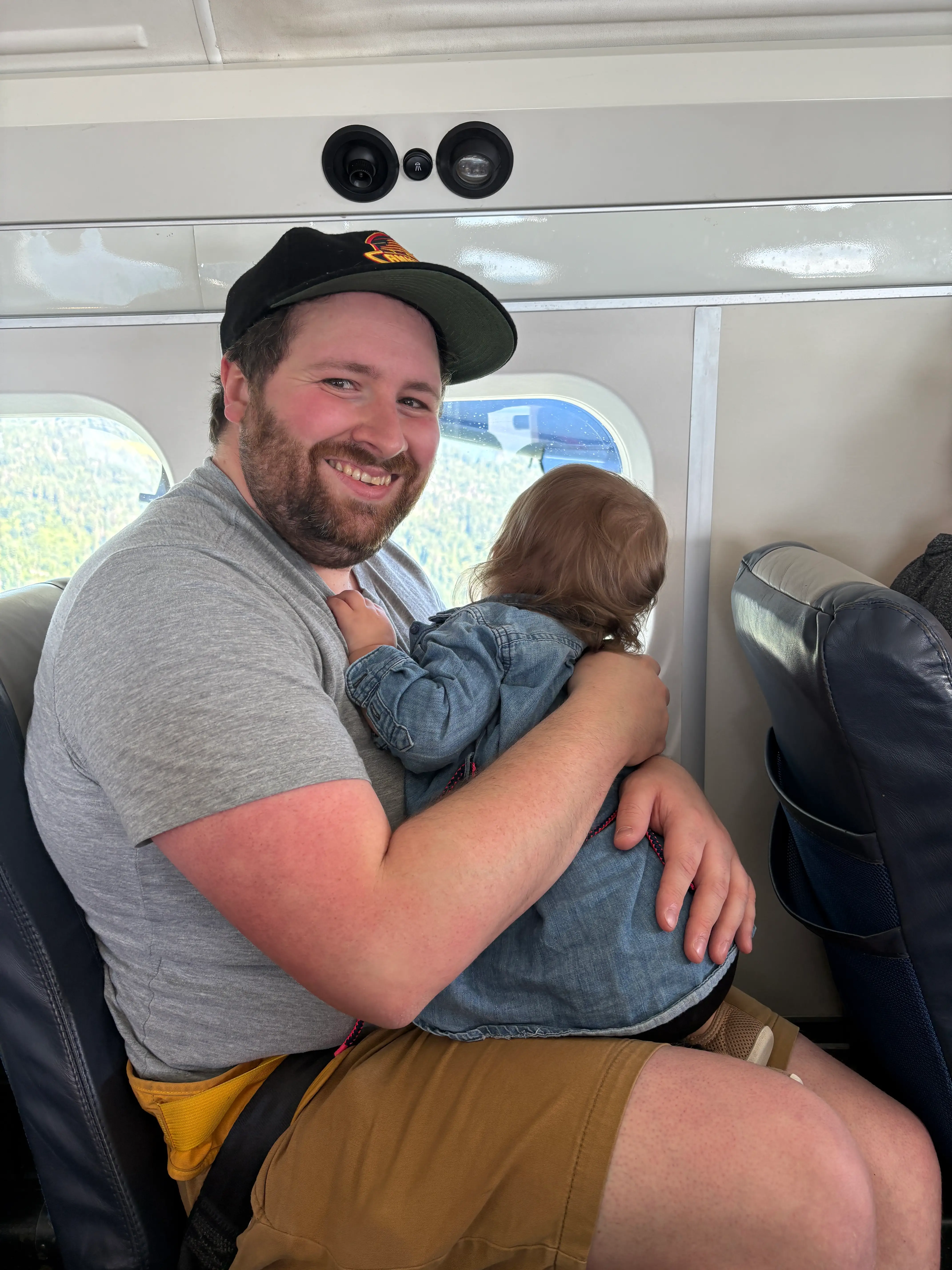 the author's husband and daughter in a seat on a seaplane