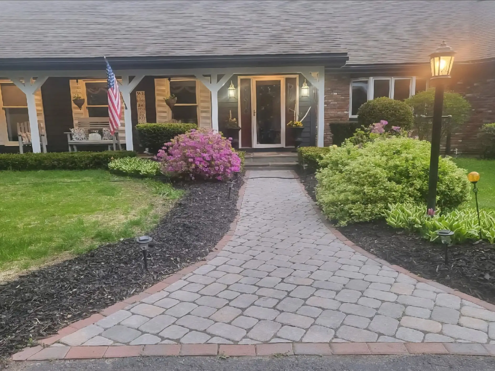 A house with a path leading up to the front door.