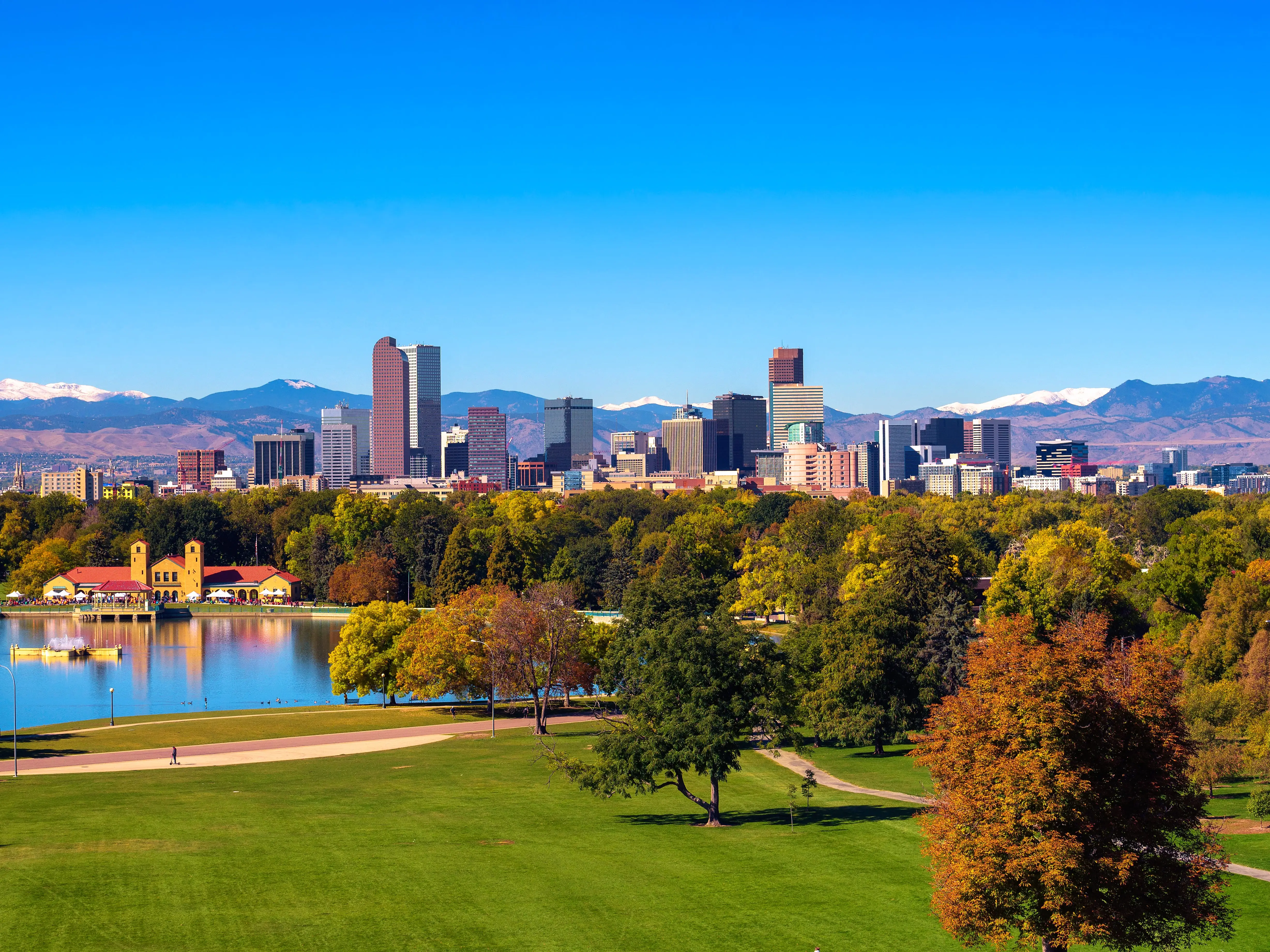 Skyline of Denver downtown with Rocky Mountains stock photo