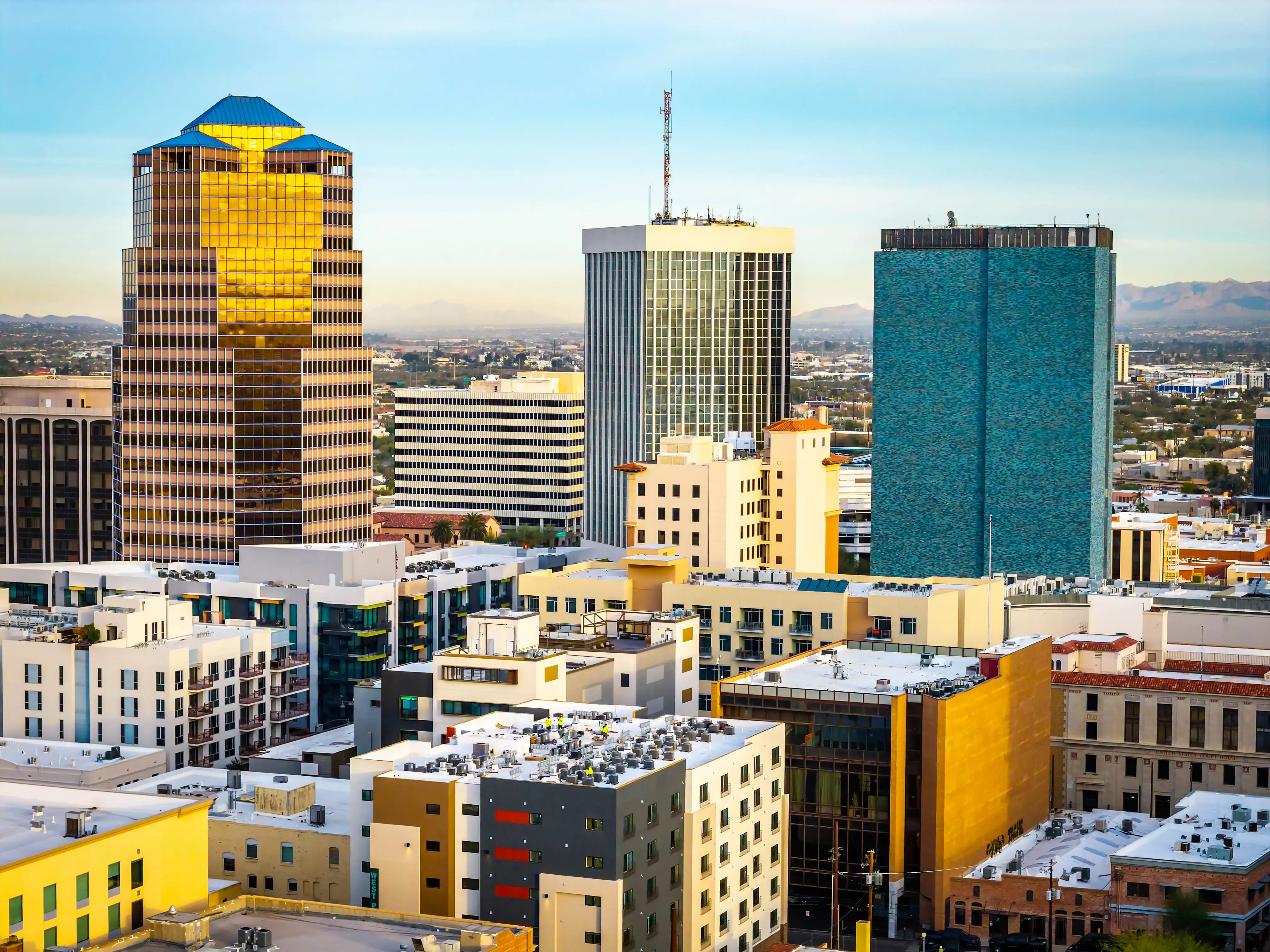 Wide aerial panorama shows Tucson skyline and surrounding desert landscape in Arizona