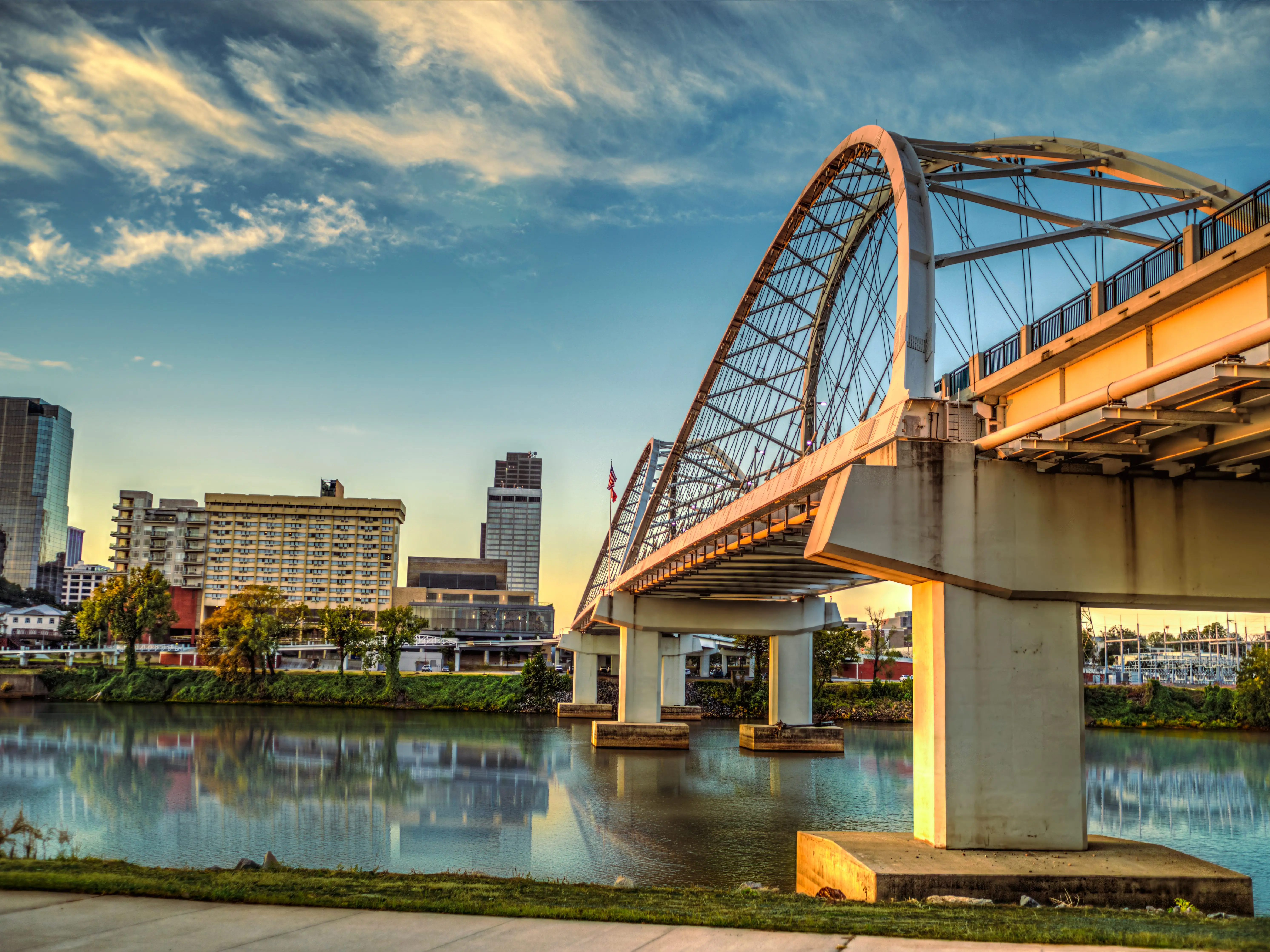 The Broadway Street Bridge spanning over the Arkansas River, in downtown Little Rock, Arkansas at sunrise.