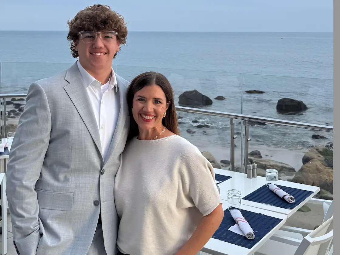 Mom and son posing for photo