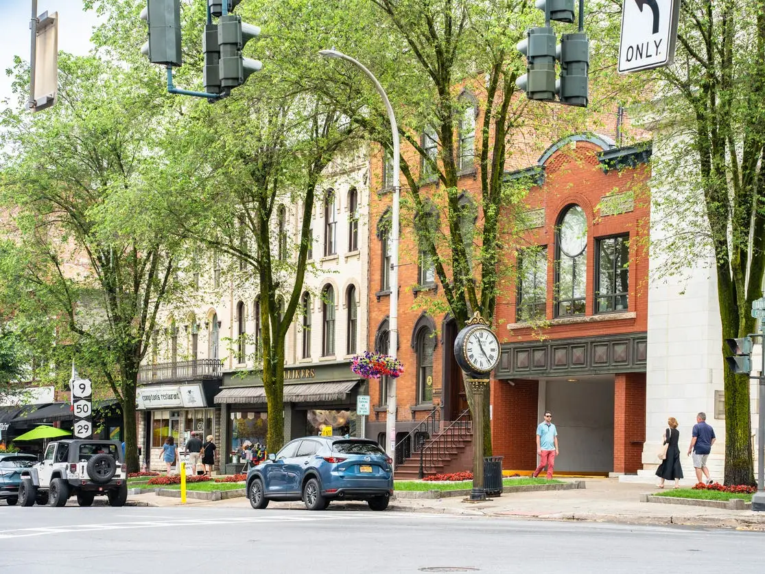 Saratoga Springs - July 12, 2025: Street scene from historic Saratoga Springs New York with historic architecture and people in view.