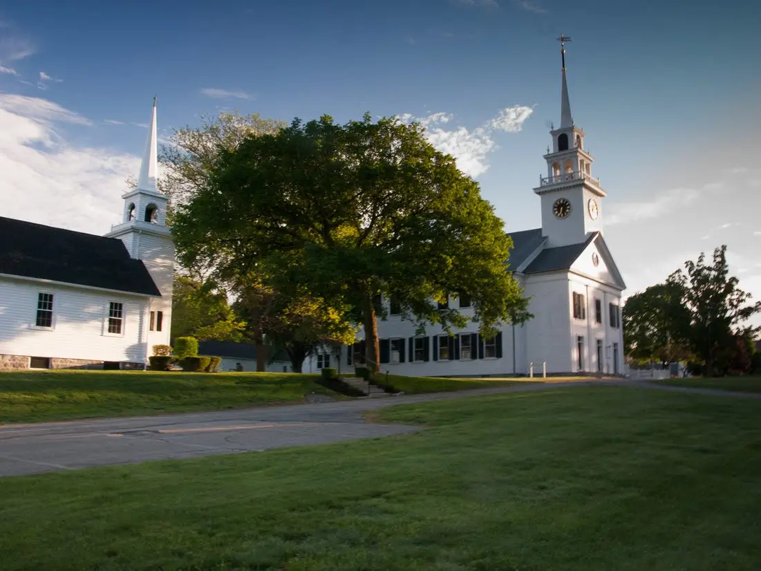 Three white churches and steeples next to the Town Common, Milton, MA