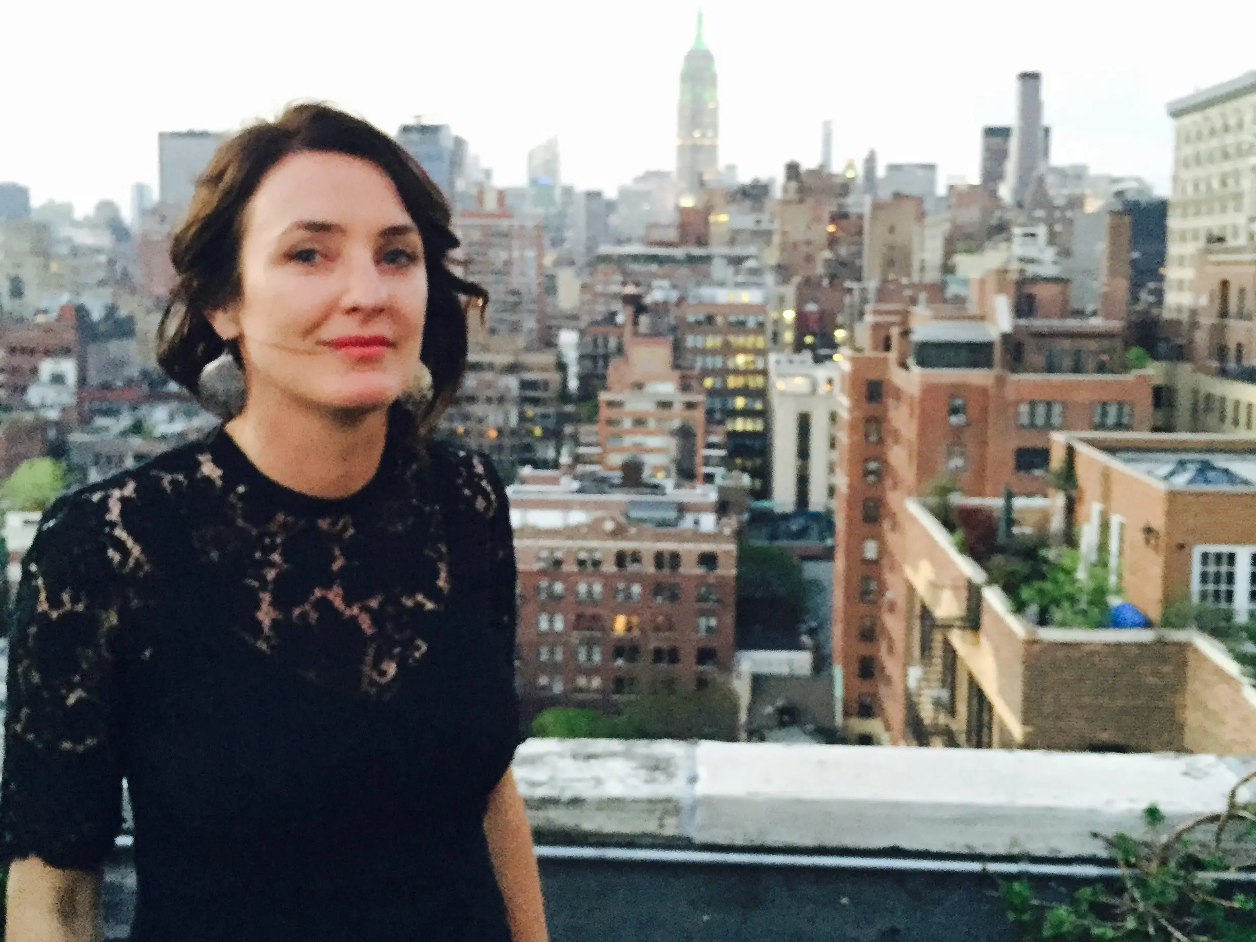 Woman with NYC skyline behind her